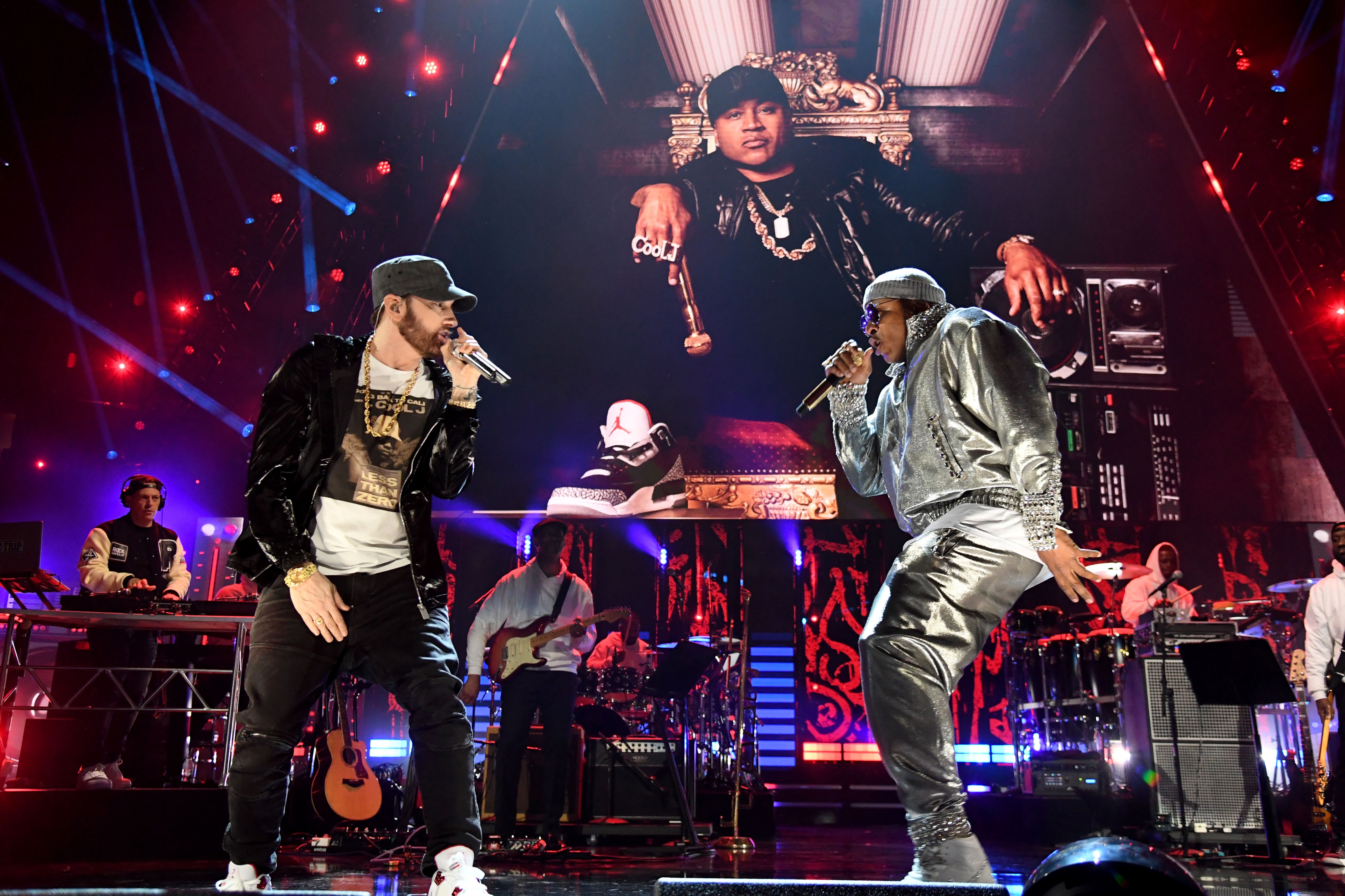 Eminem and LL Cool J perform on stage together. 