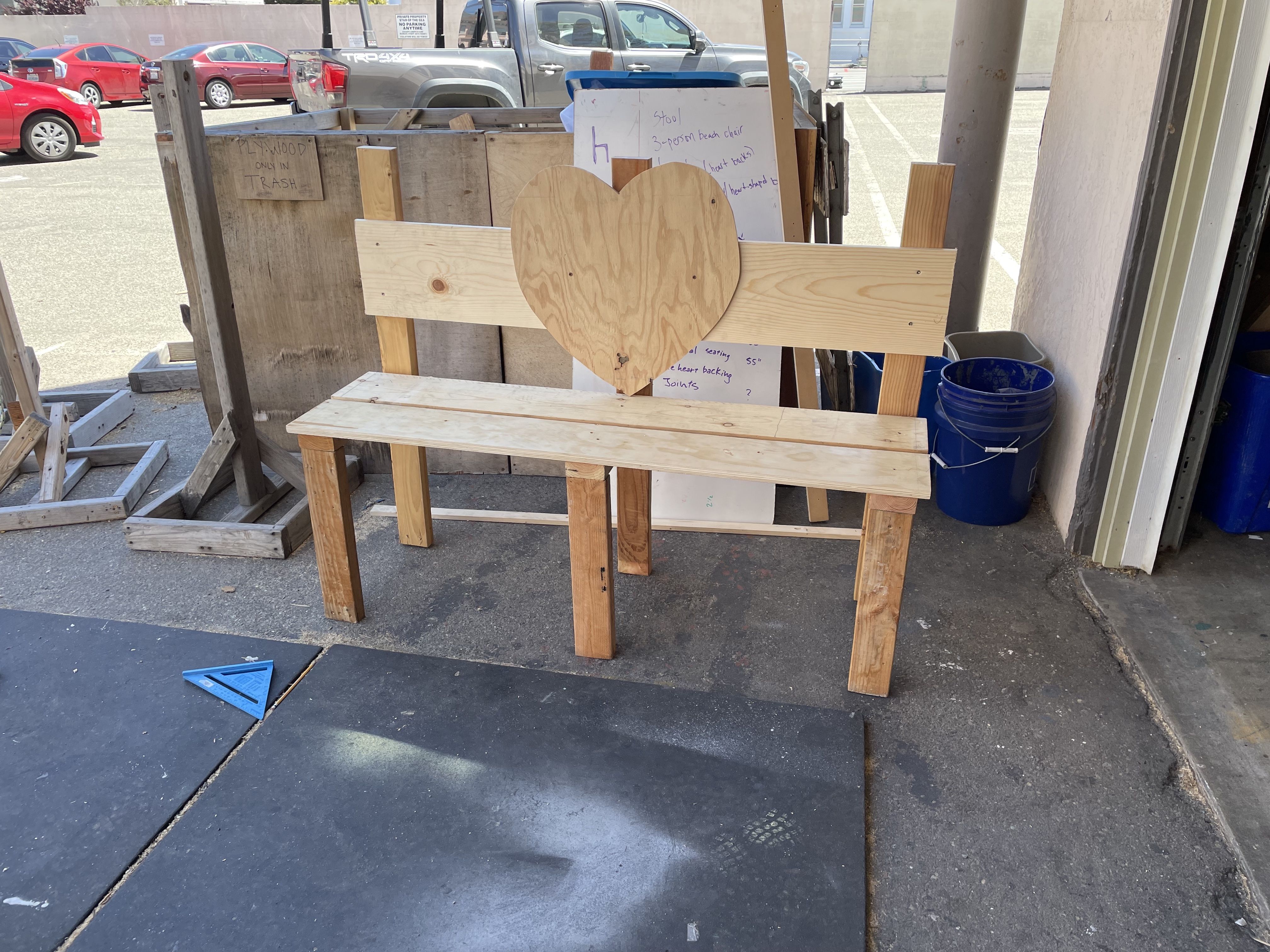 A bench with a heart attached the seat.
