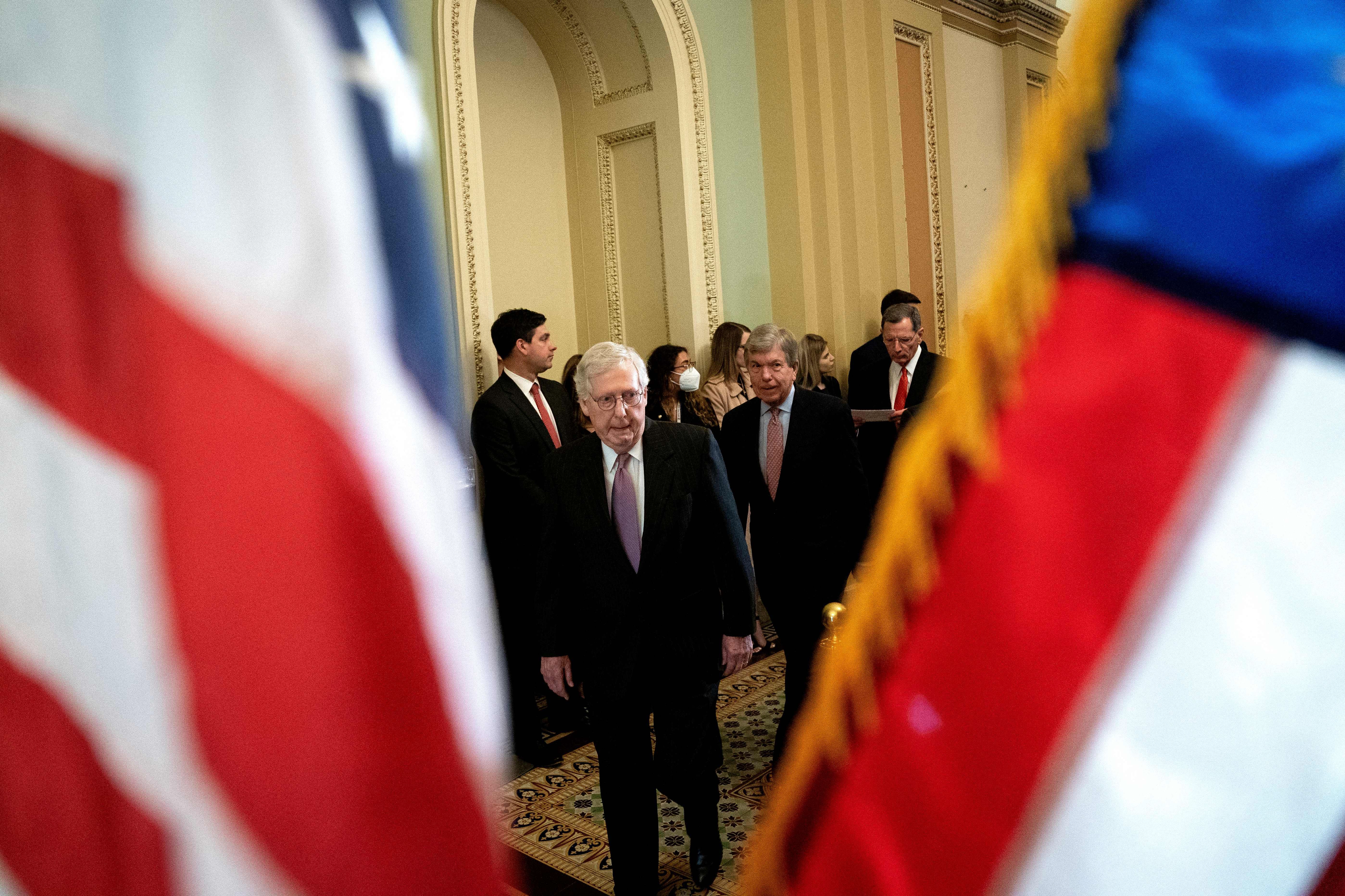 Senate Minority Leader Mitch McConnell is seen approaching a news conference on Tuesday.
