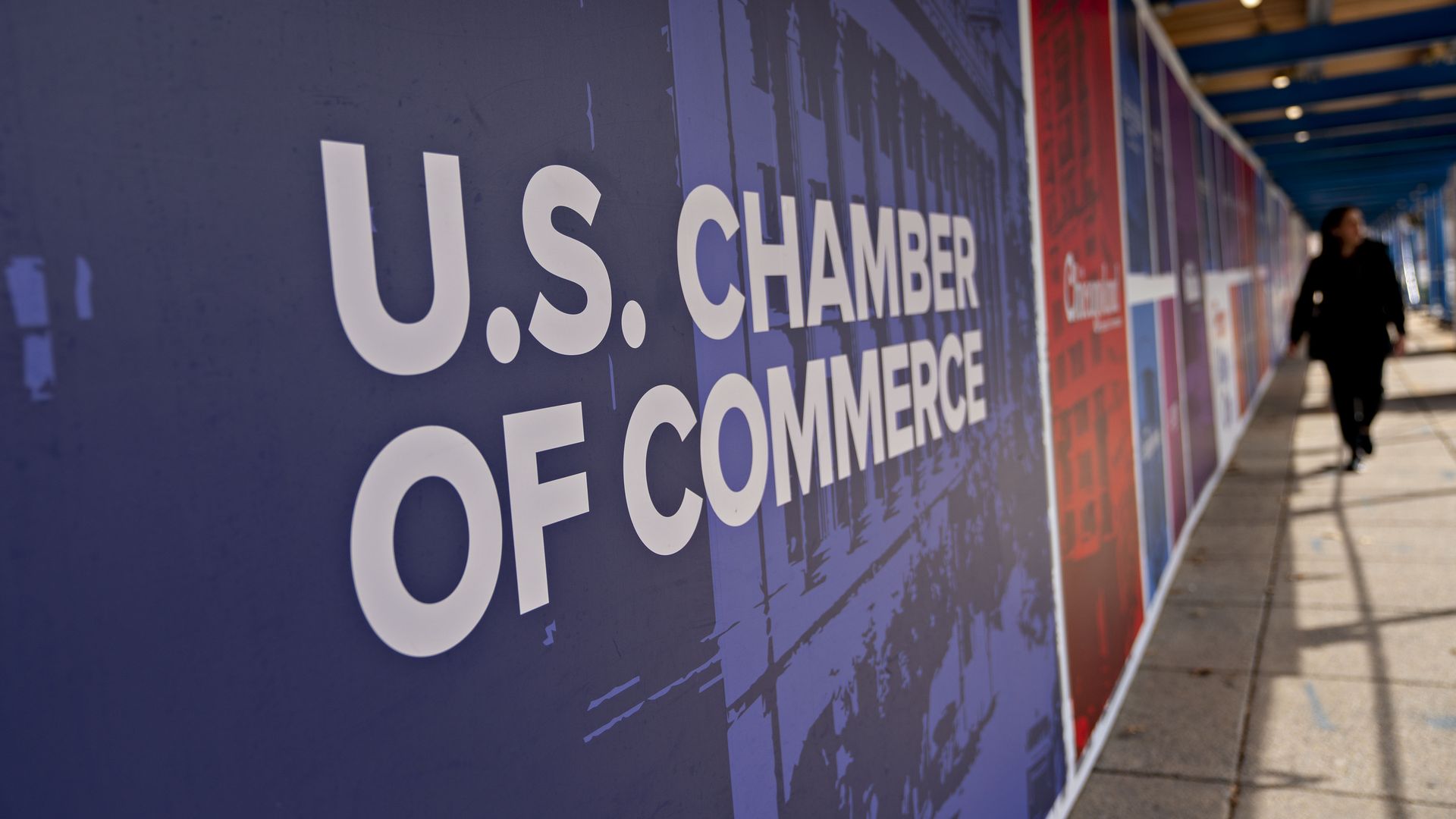 A pedestrian is seen passing the U.S. Chamber of Commerce headquarters as it undergoes renovation.