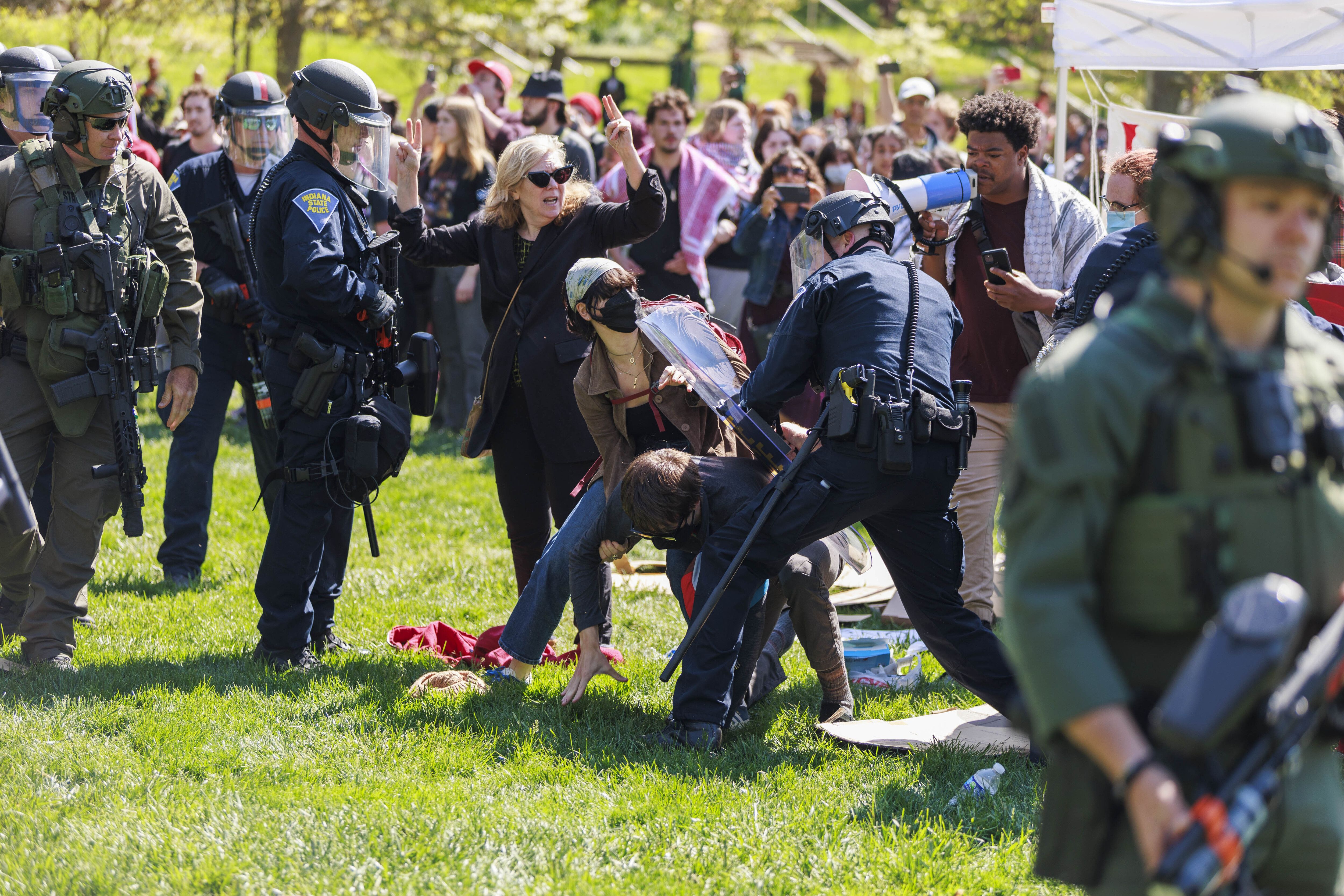 A police officer arresting protestors