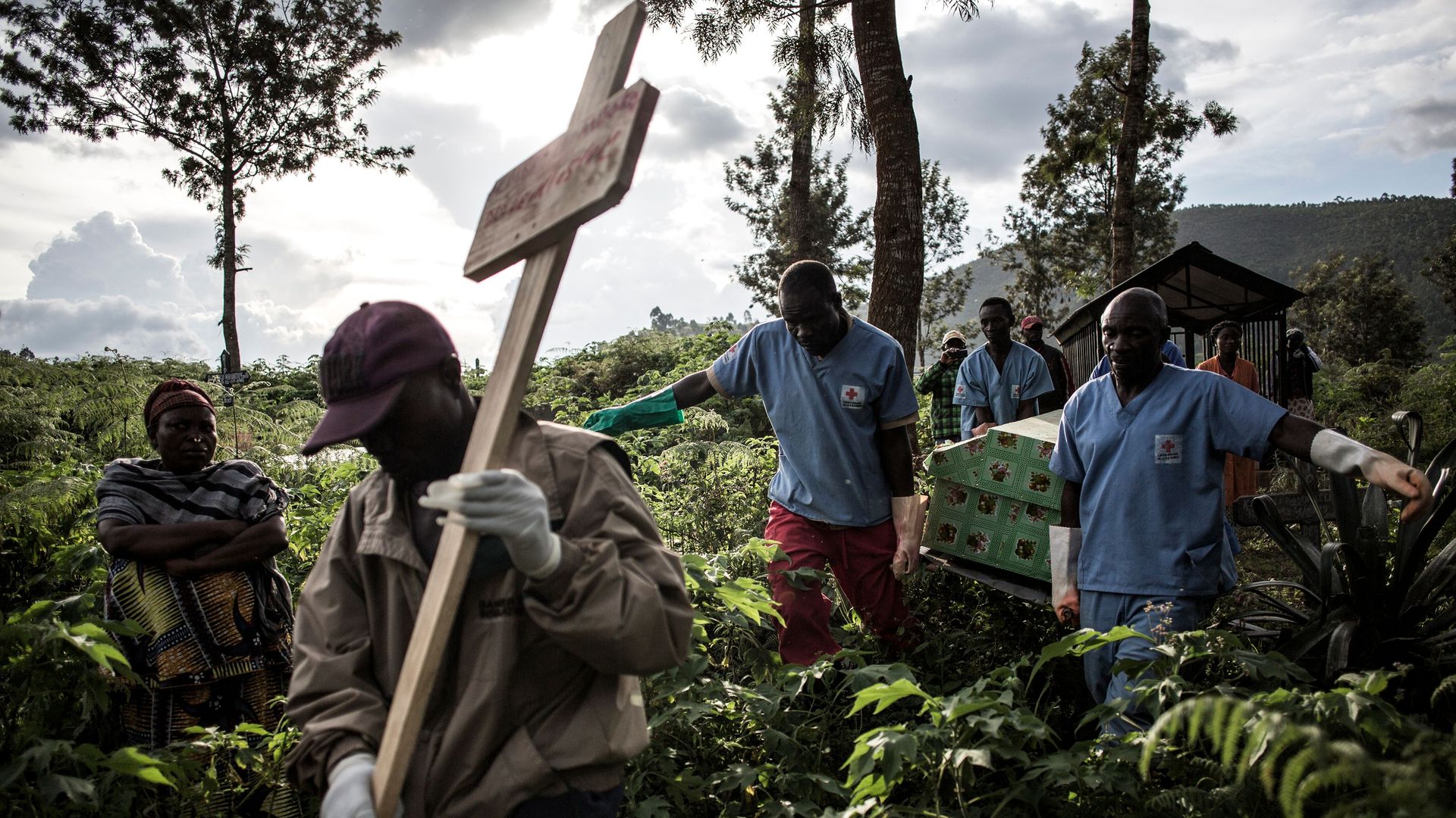 Health workers carry a coffin containing a victim of Ebola virus in Butembo in May. Photo: John Wessels/AFP/Getty Images