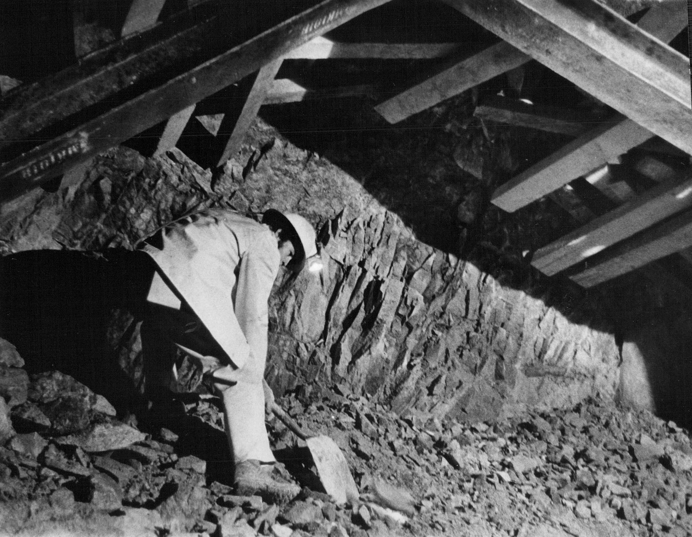 NOV 14 1972, NOV 15 1972 A hard-rock miner clears granite debris form cross-bore drill that will connect both halves of Eisenhower Memorial Tunnel. Credit: Denver Post, Inc. (Denver Post via Getty Images)