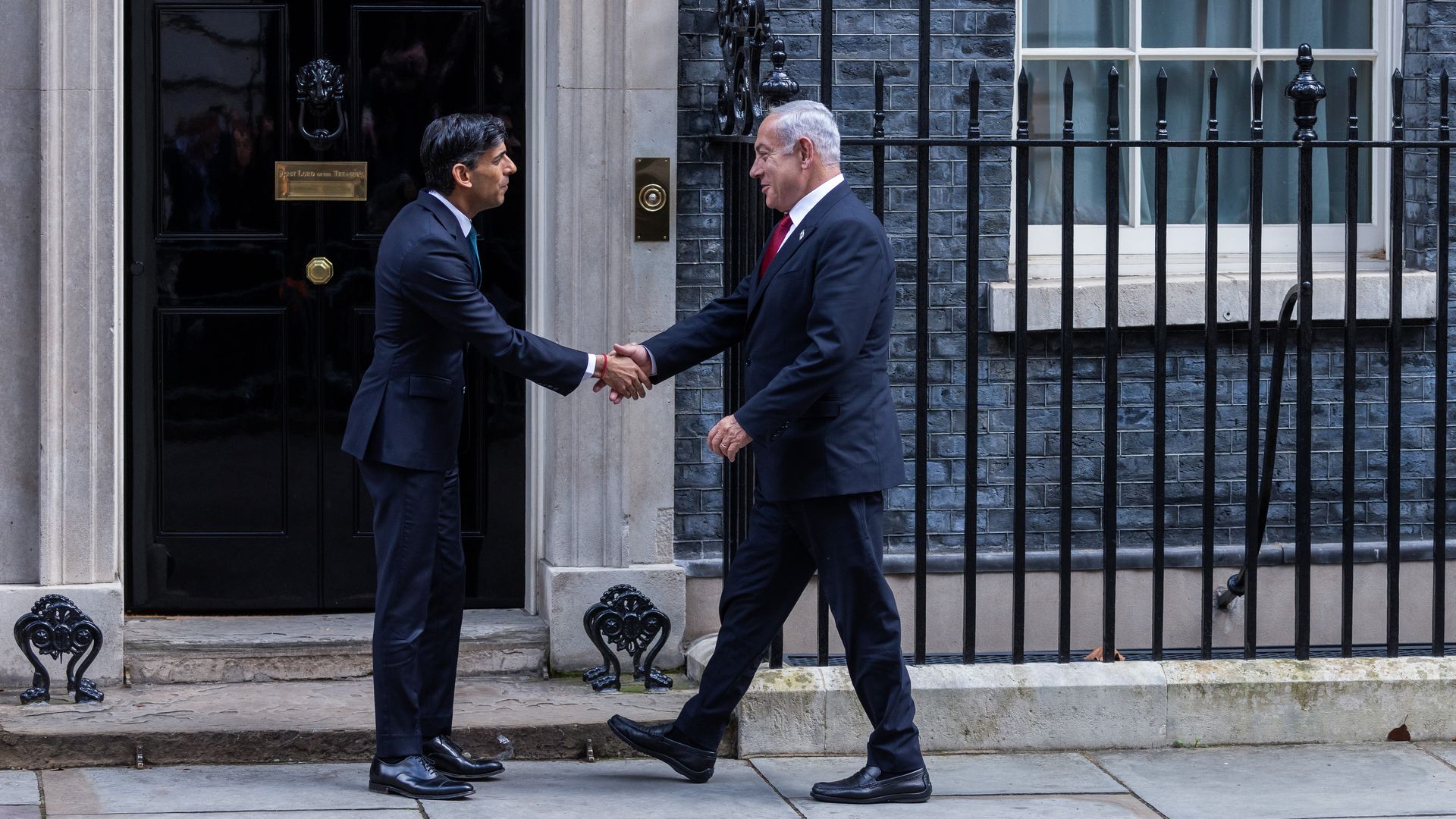 U.K. Prime Minister Rishi Sunak shakes hands with Israeli Prime Minister Benjamin Netanyahu