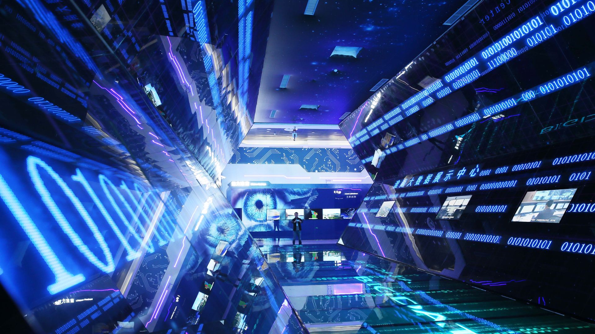 Big data demonstration in blue glass hallway