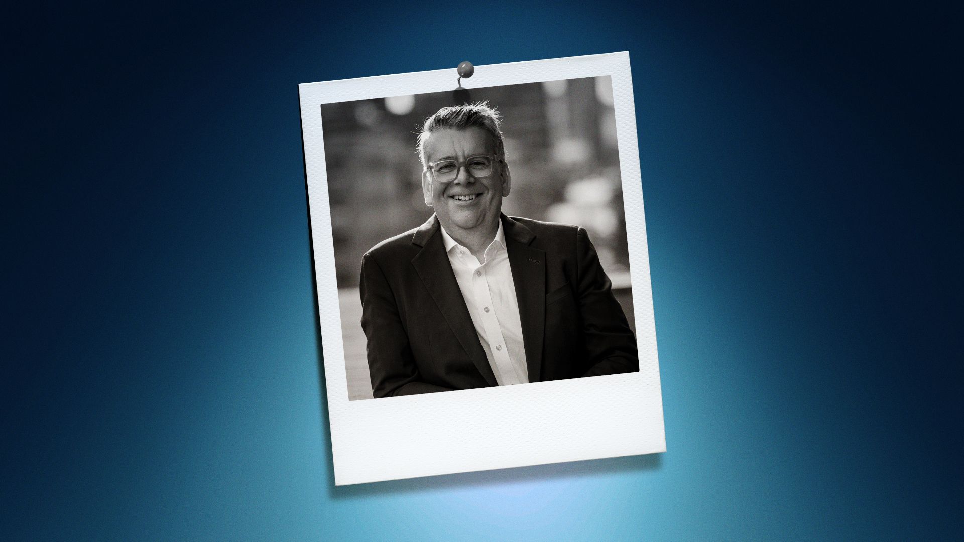 Photo illustration of Anthony Kiendl in a polaroid on a blue background. 