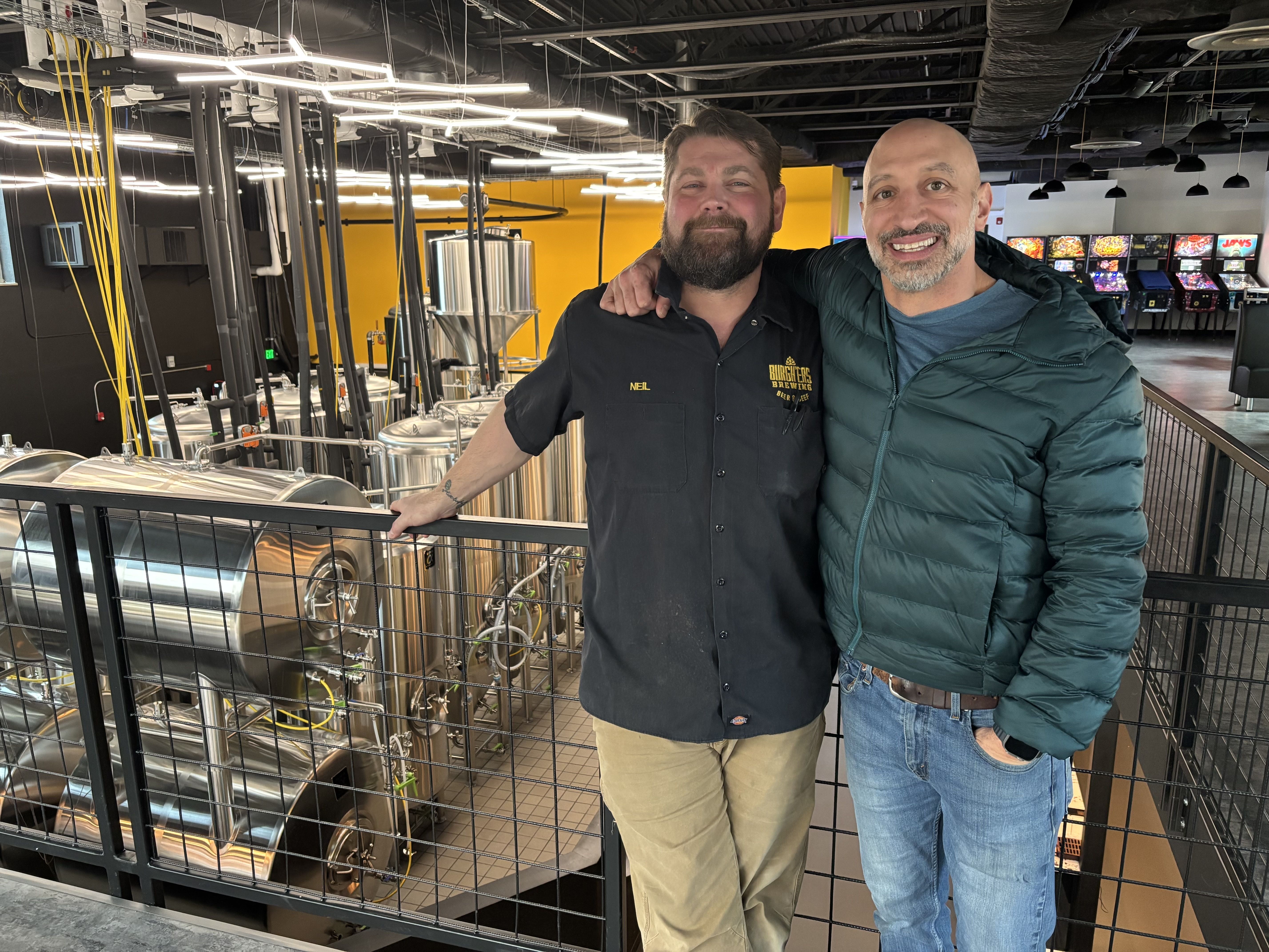 Burghers co-owners Neil Glausier (left) and Fiore Moletz (right) on the second level of their new flashship brewery in Millvale, Pa.