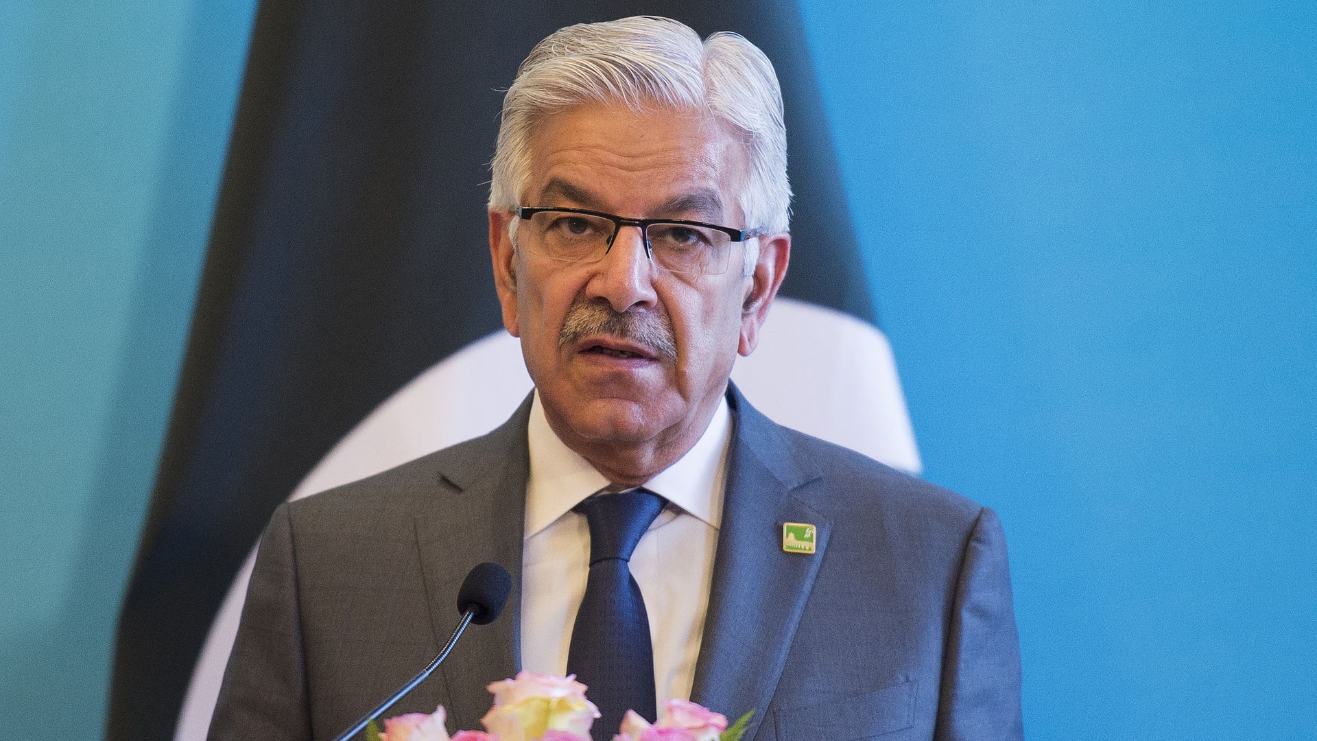 Asif at a lectern