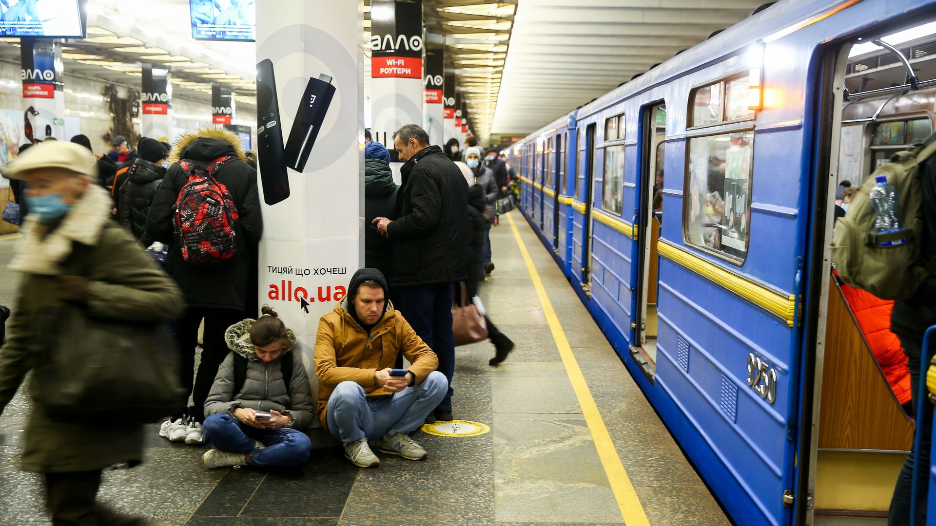 Ukrainians are seen huddling in a Kyiv subway station during Russia's assault on Thursday.