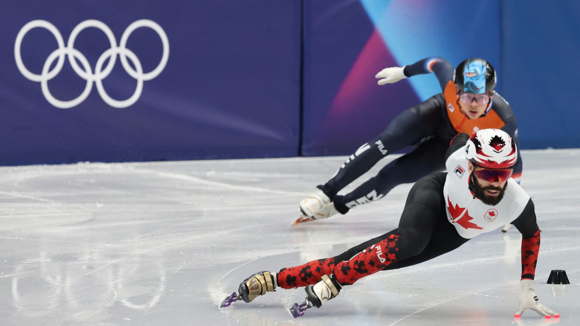 Canada's Steven Dubois winning the gold medal in the 500 meter short-track speedskating on Tuesday