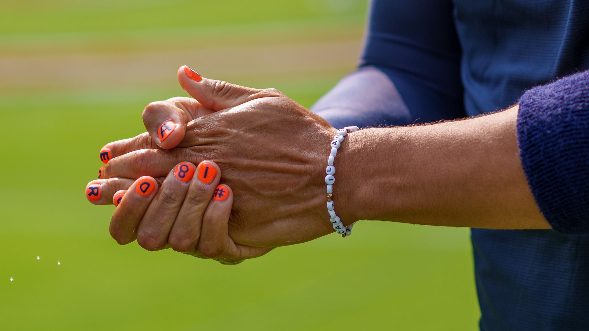 Photo of a football player's painted fingernails 