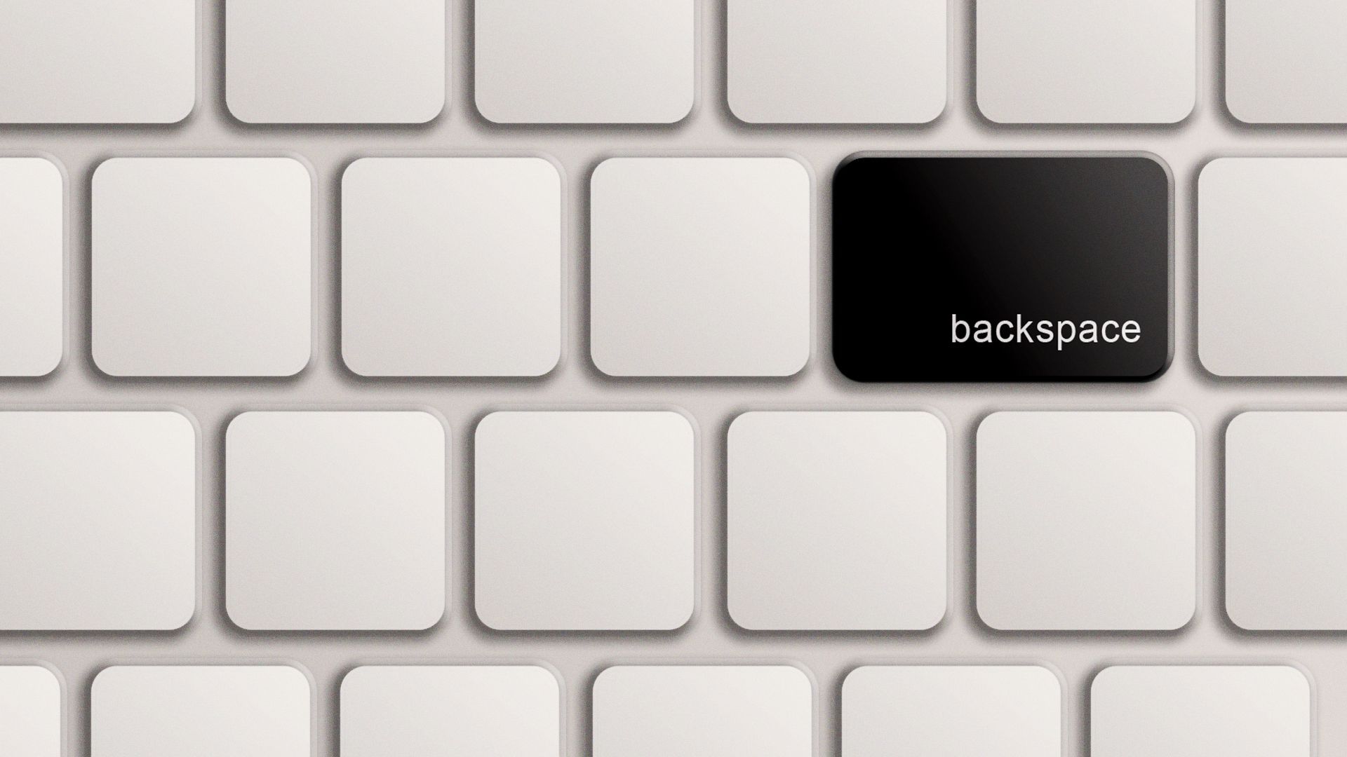 Illustration of a keyboard with one black backspace key surrounded by all white keys. 