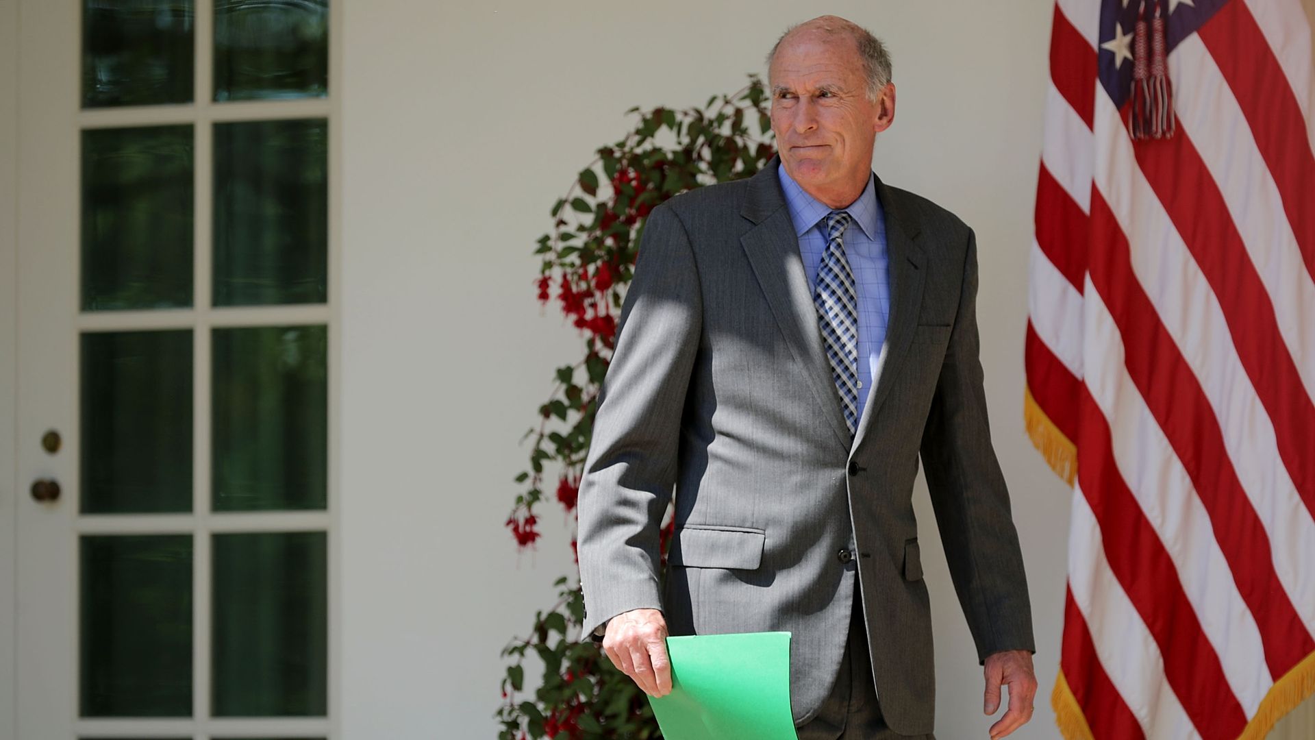 U.S. Director of National Intelligence Dan Coats walks along the Rose Garden Colonnade before an event to mark the National Day of Prayer at the White House May 3