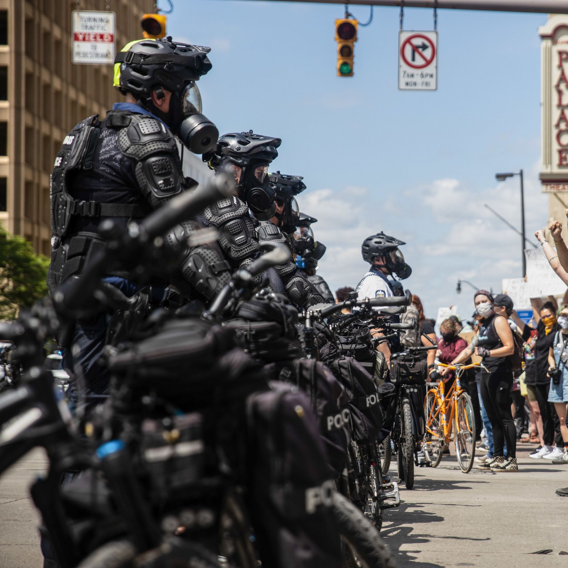 Police in riot gear patrol a Columbus protest in 2020.