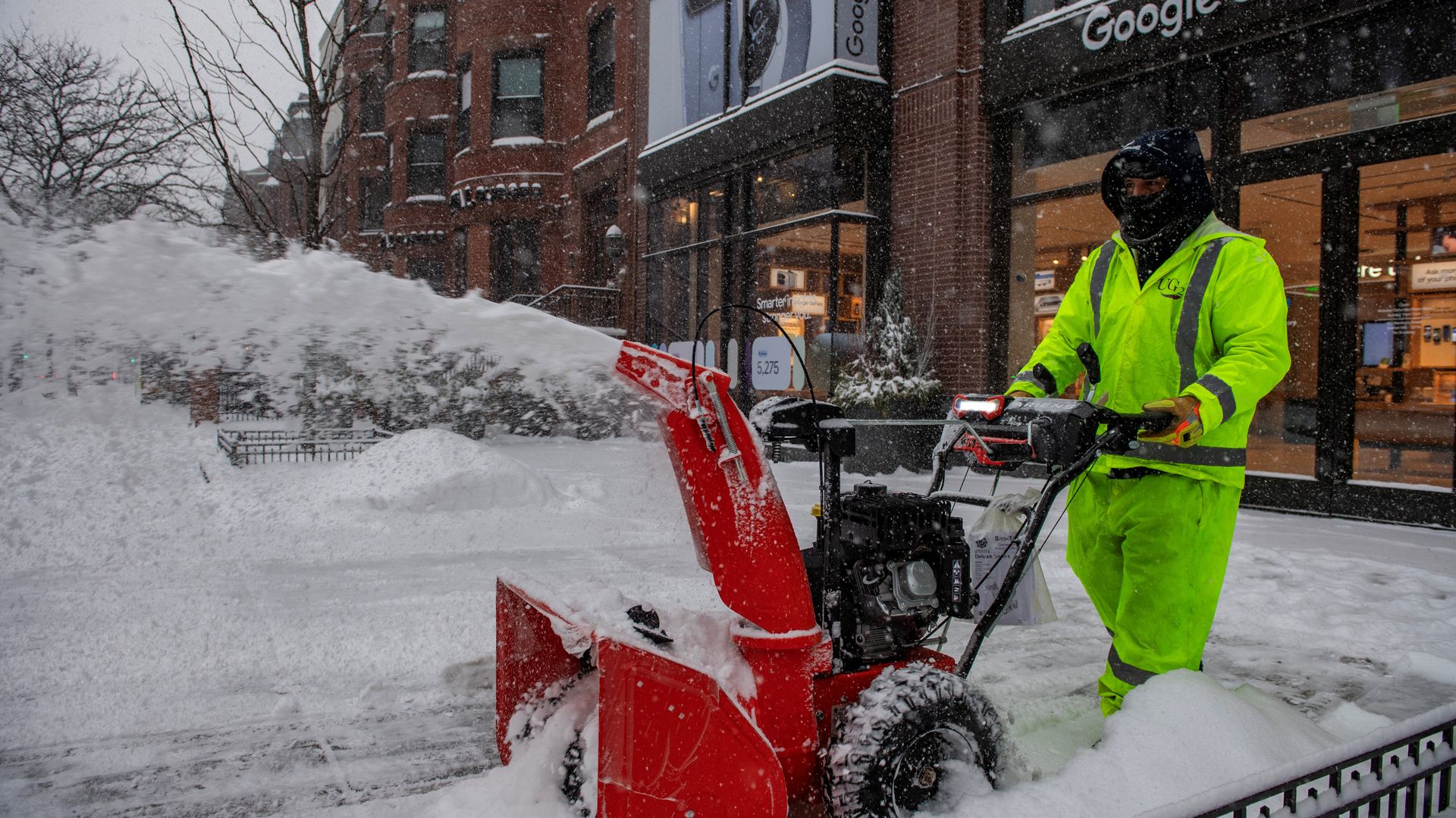 A worker clears snow with a snow plow in Copley Square during a snowstorm in Boston, Massachusetts, on January 25, 2026. 