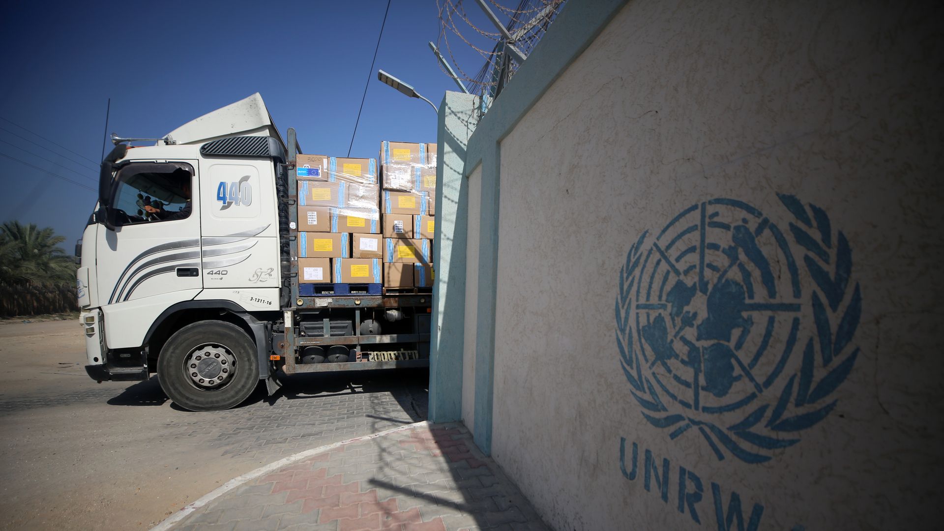 Workers of the United Nations Relief and Works Agency for Palestine Refugees (UNRWA) pack the medical aid and prepare it for distribution to hospitals at a warehouse in Deir Al-Balah, Gaza