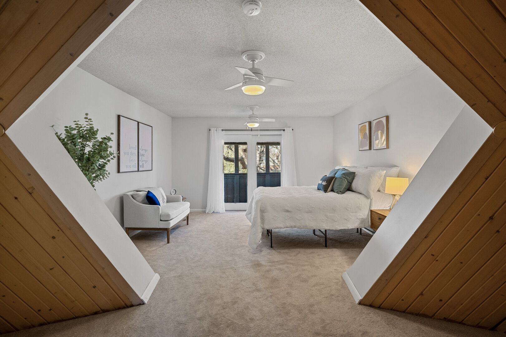 A bedroom with a geometric-shaped door.