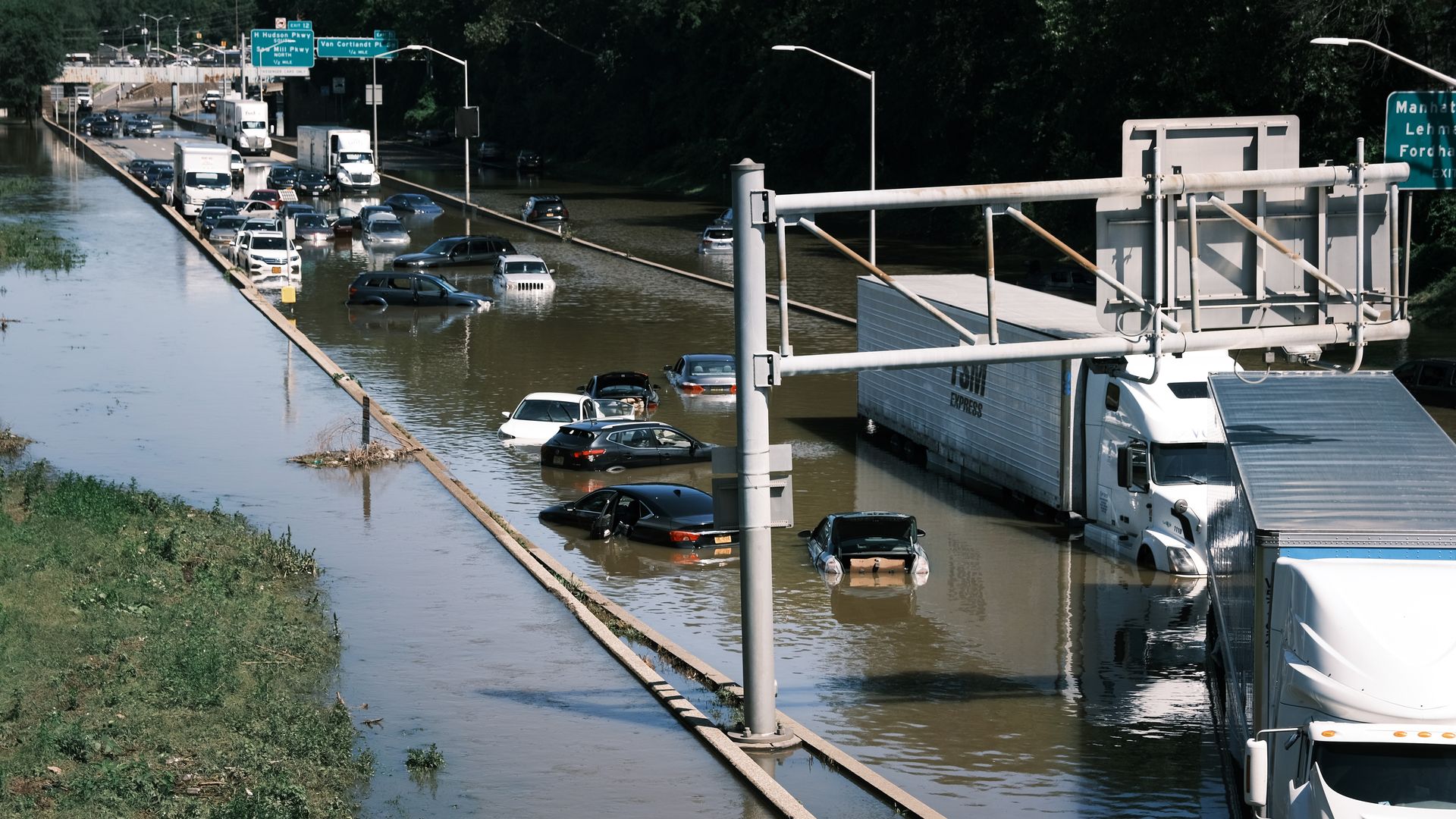 Abandoned cars on a flooded freeway