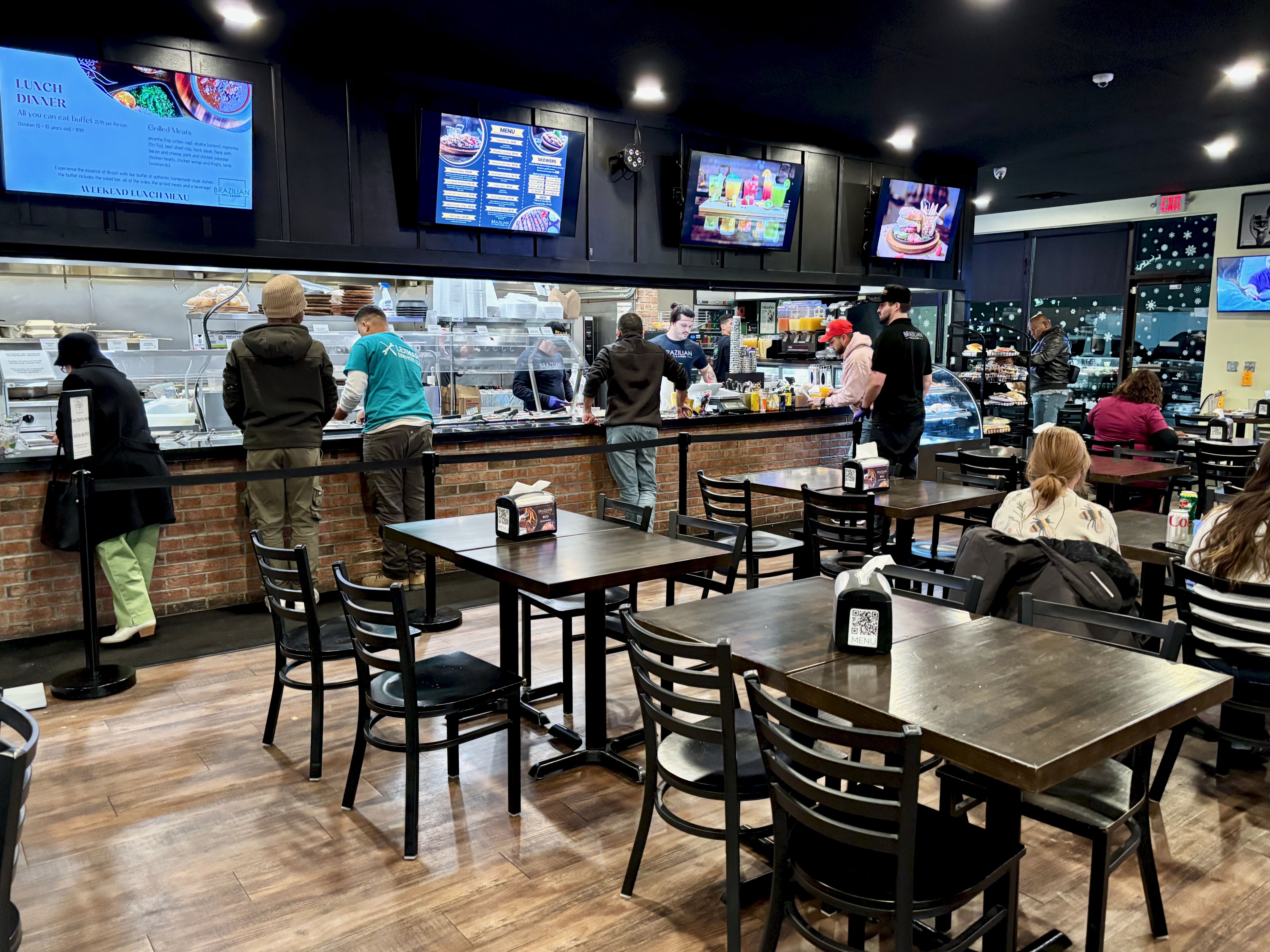 An overview of the dining area and buffet at Brazilian Grill & Bakery