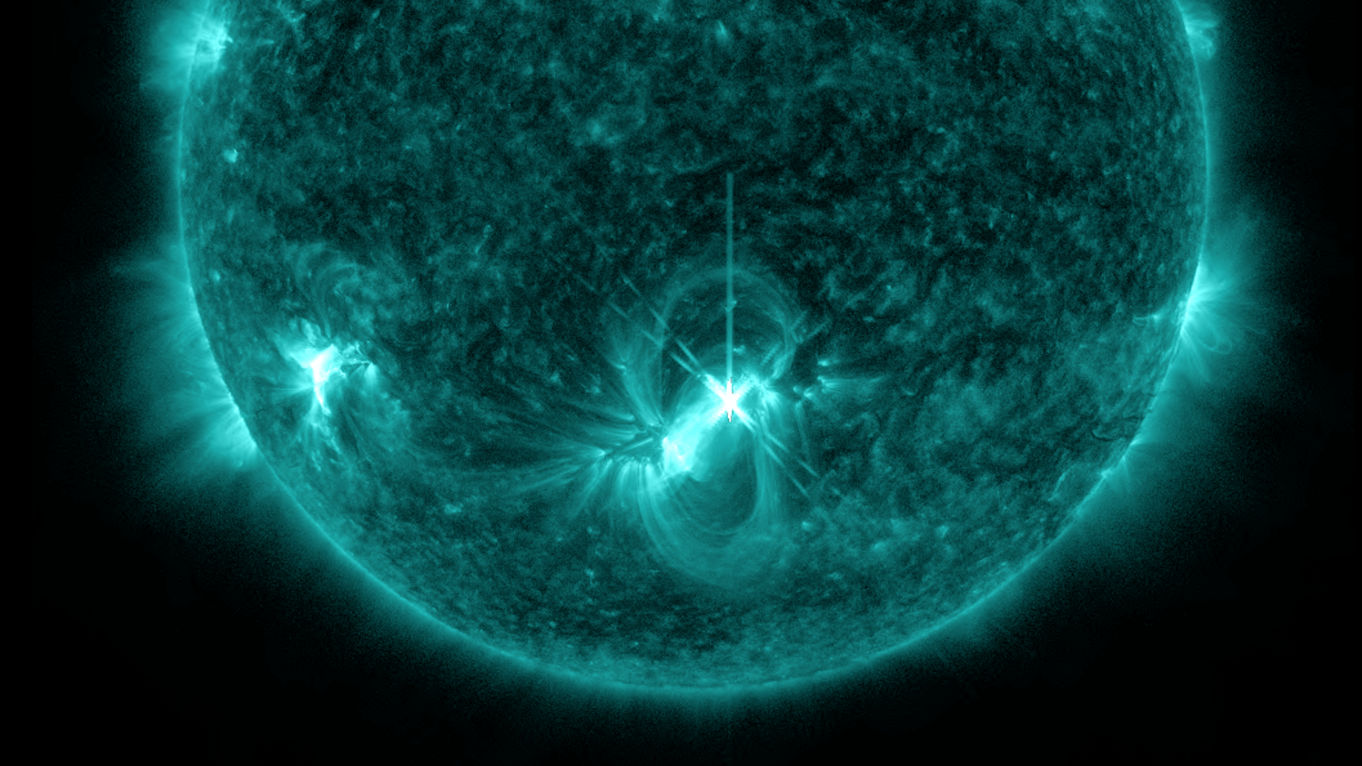 A solar flare erupting from the Sun, seen in blue