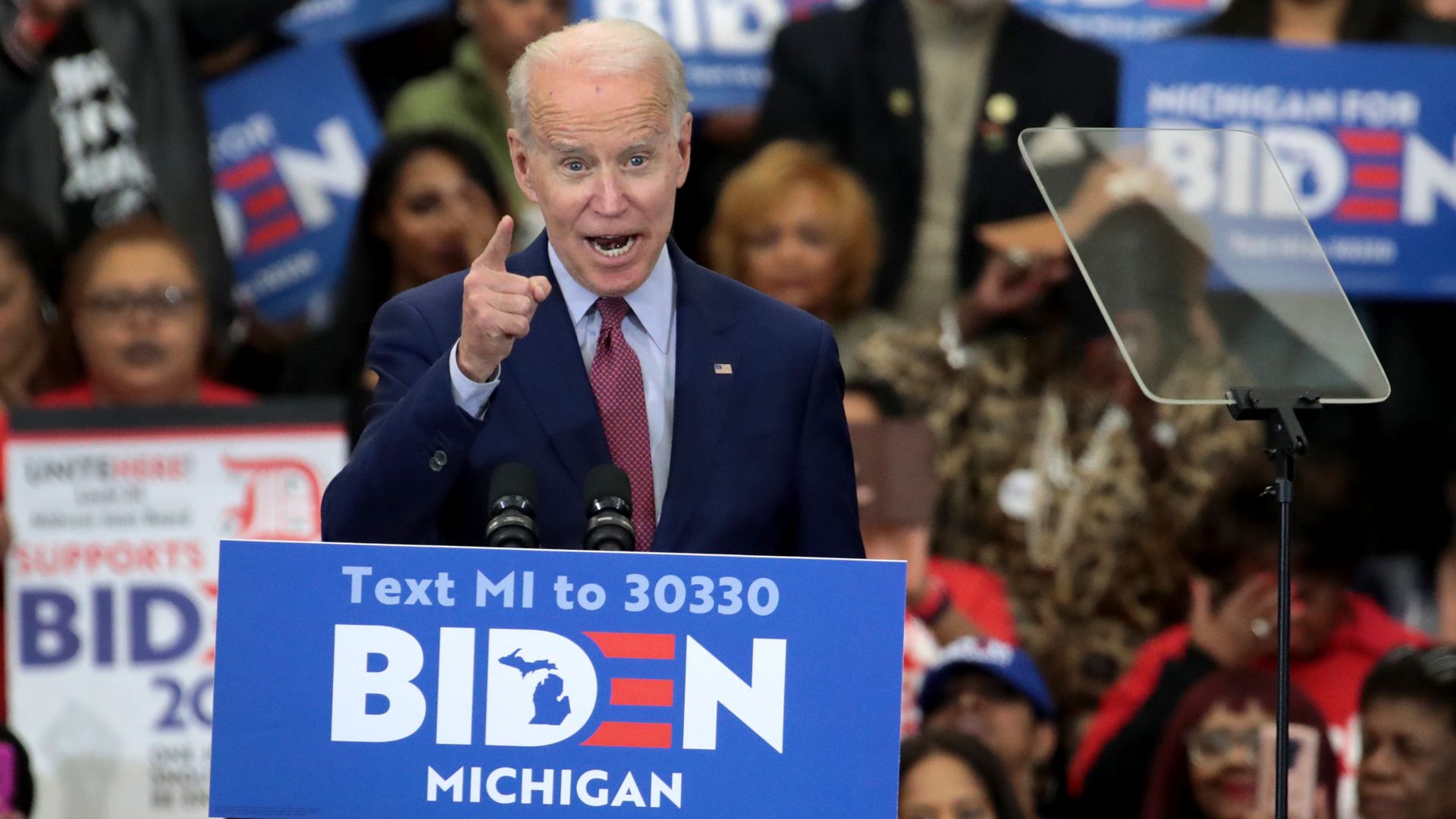 Joe Biden shouts at a Detroit rally