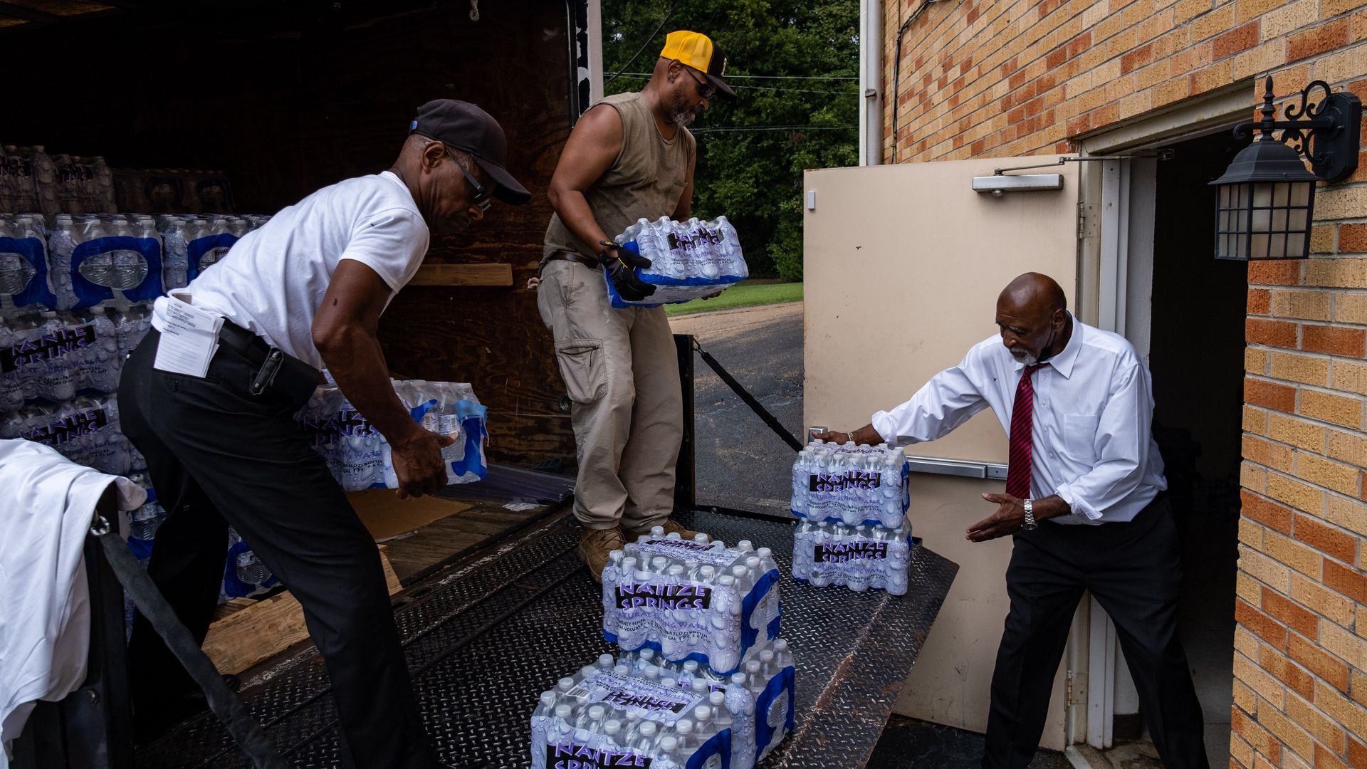 People moving cases of water into a Baptist church in Jackson, Mississippi, on Sept. 4.