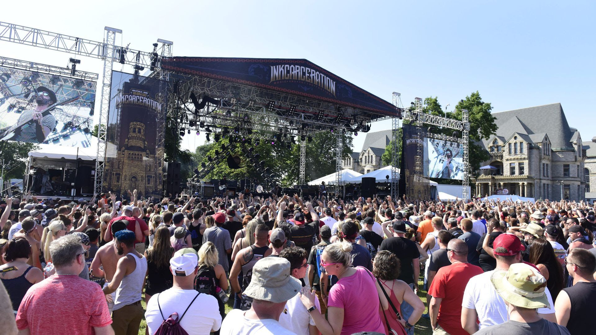 A large crowd gathers near the stage at the 2019 Inkcarceration music festival. 