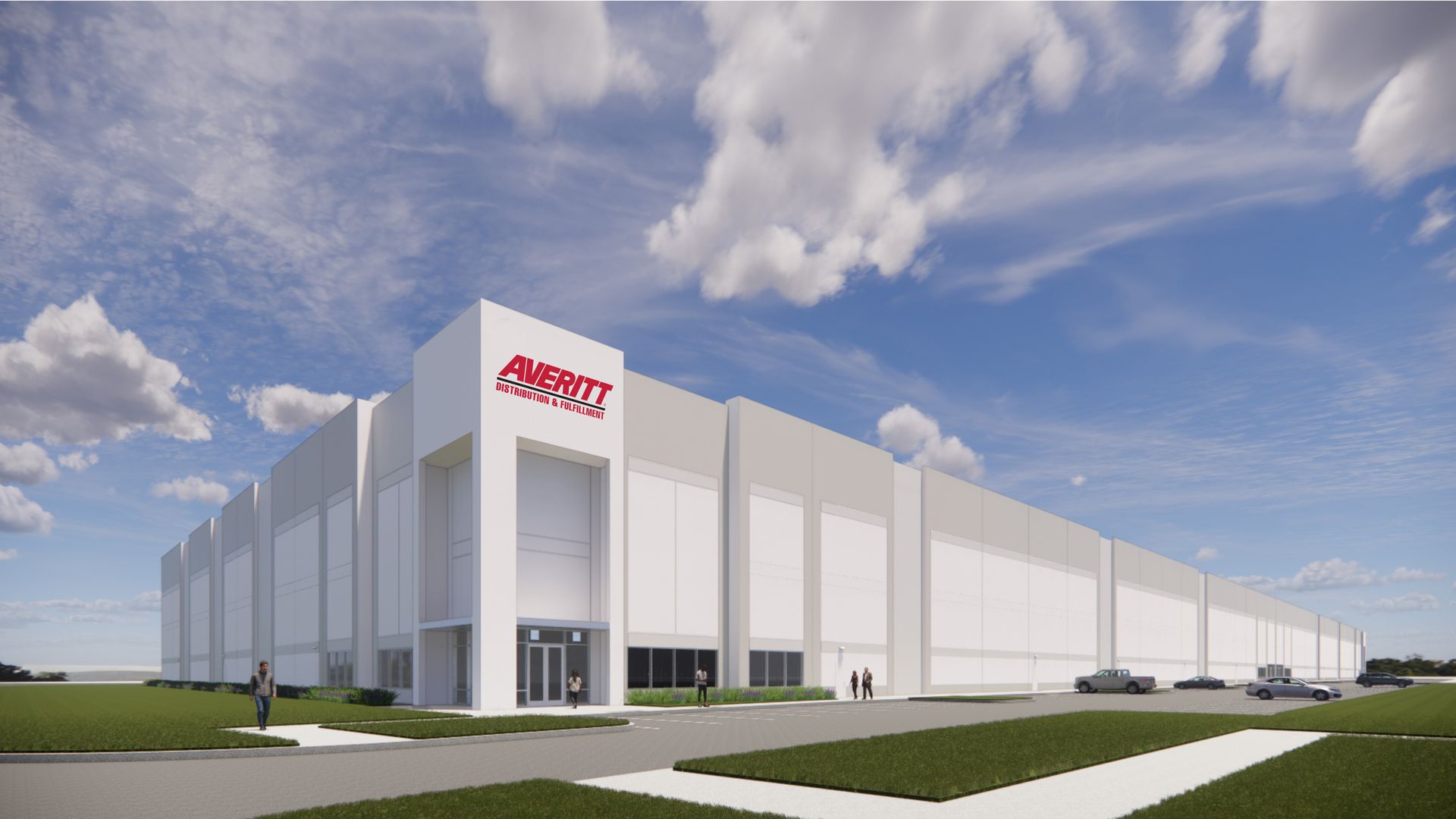 Modern white warehouse building with a red AVERITT sign on a corner tower, under a bright blue sky with clouds; a few people near the entrance and cars in the lot.