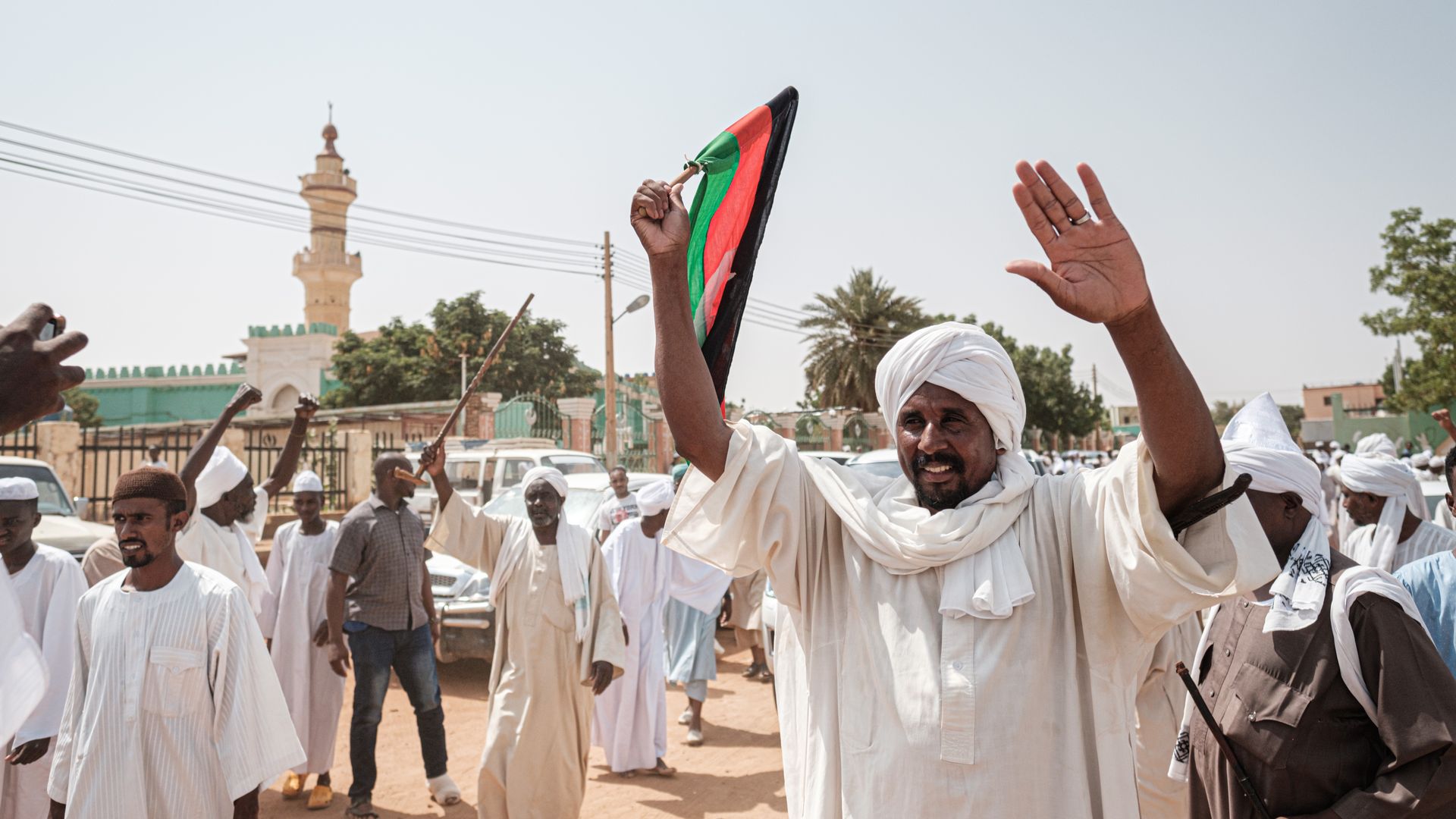 Sudanese citizens leaving a mosque after calls for an investigation into a protest that became violent