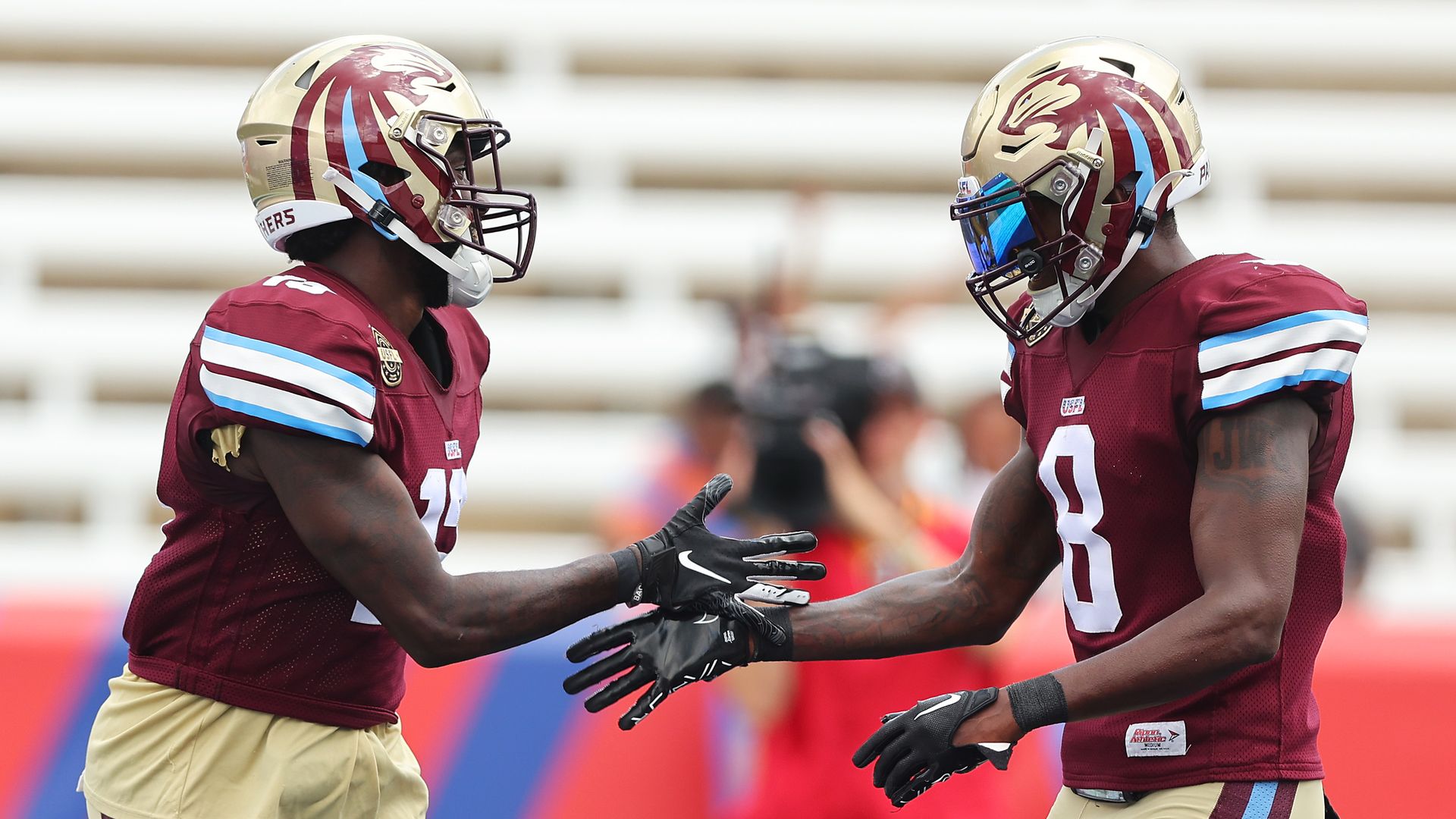 shmael Hyman of the Michigan Panthers celebrates after scoring a touchdown with Joe Walker in the second quarter of the game against the New Jersey Generals at Protective Stadium on June 11, 2022