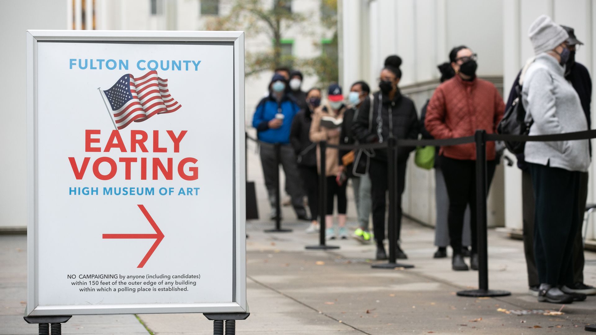 : Voters line up for the first day of early voting outside of the High Museum polling station on December 14, 2020 in Atlanta, Georgia.