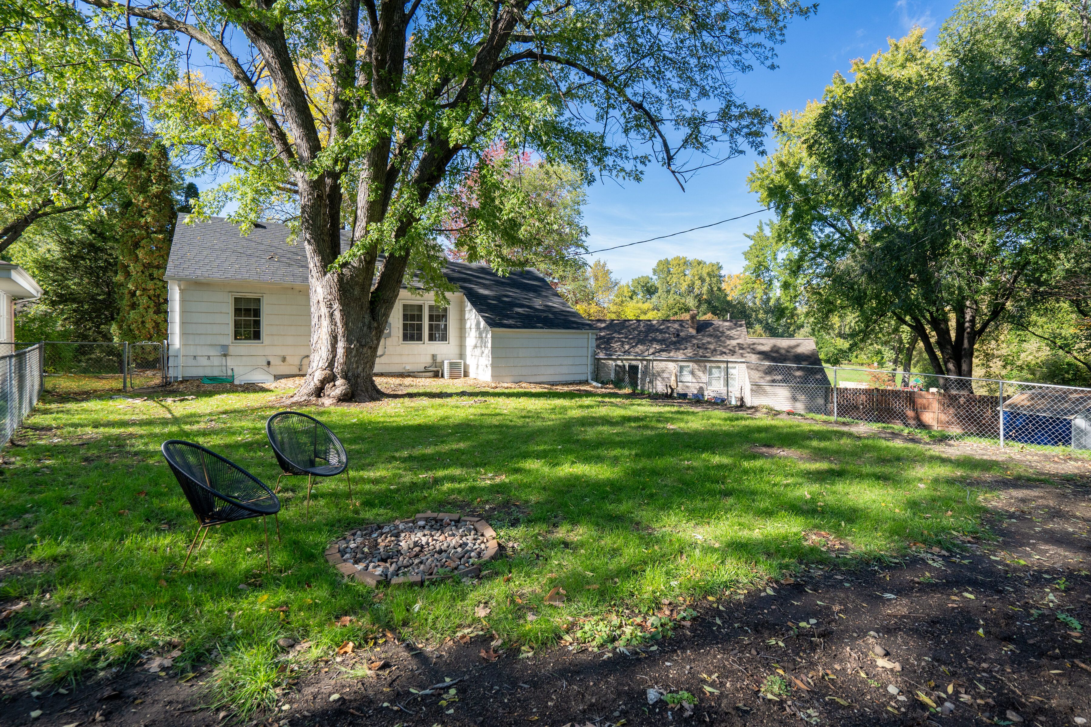 large backyard with fire pit