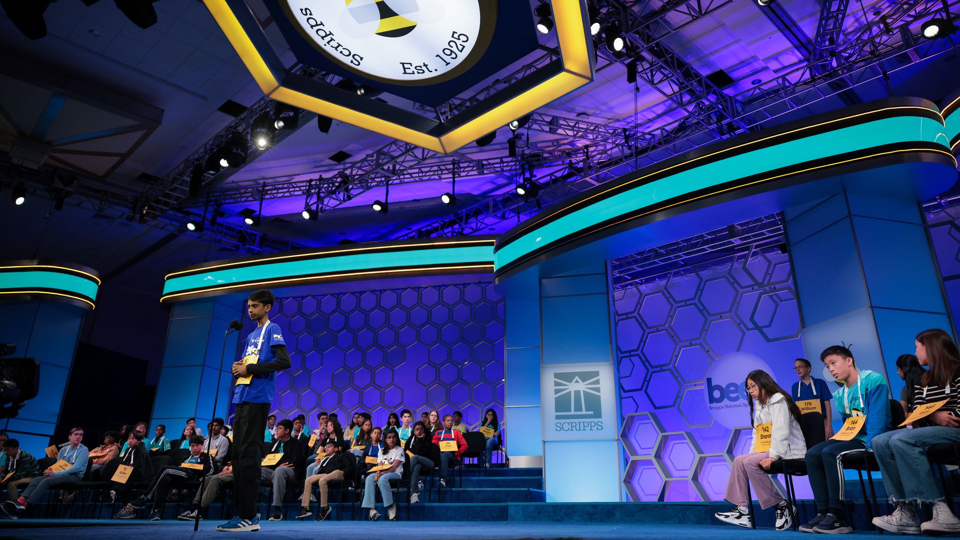 Avinav Prem Anand, 14, of Columbus, Ohio, spells his word in the quarterfinals of the 2025 Scripps National Spelling Bee at the Gaylord National Resort and Convention Center on May 28, 2025 in National Harbor, Maryland.