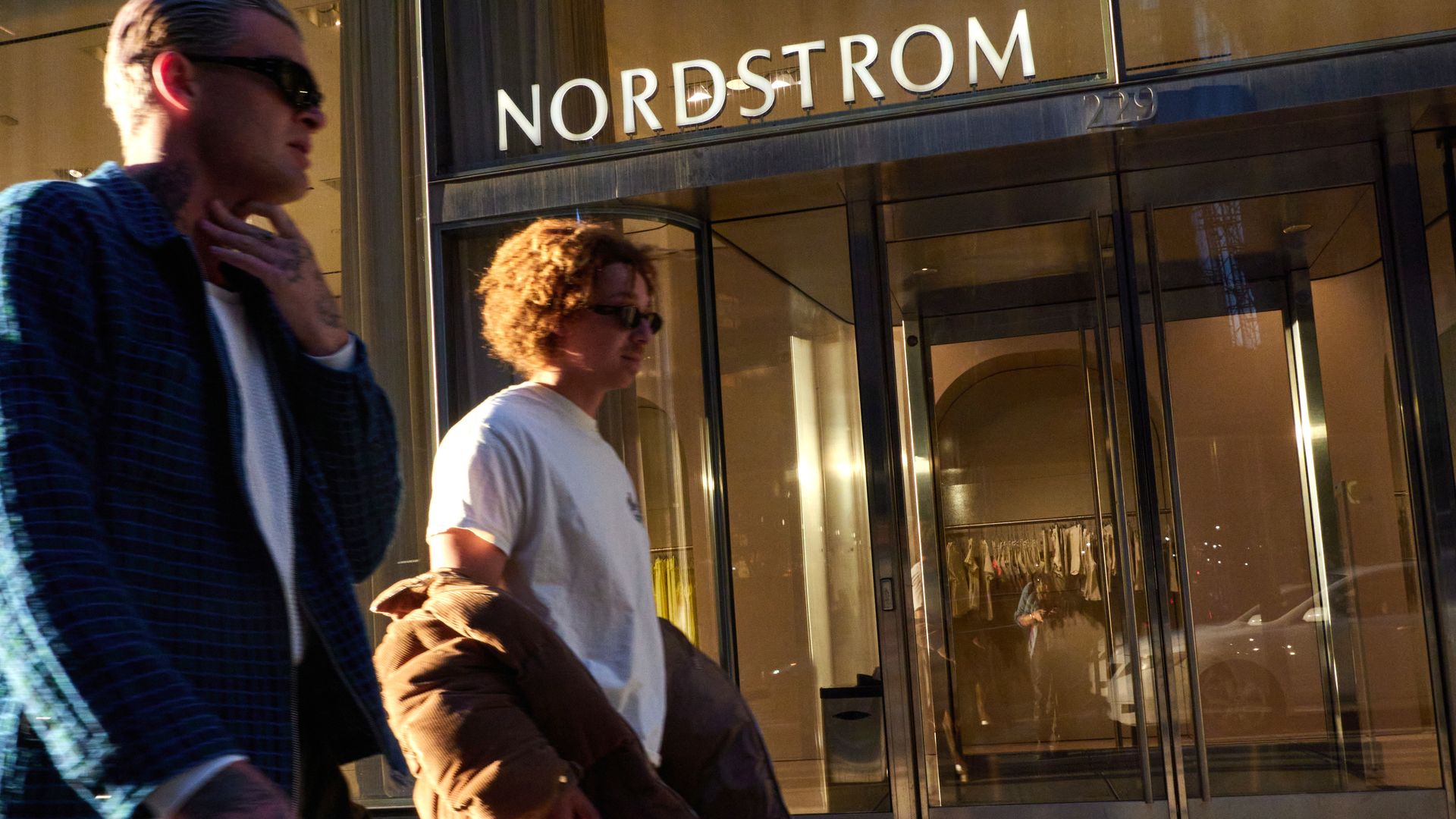 shoppers in front of nordstrom store