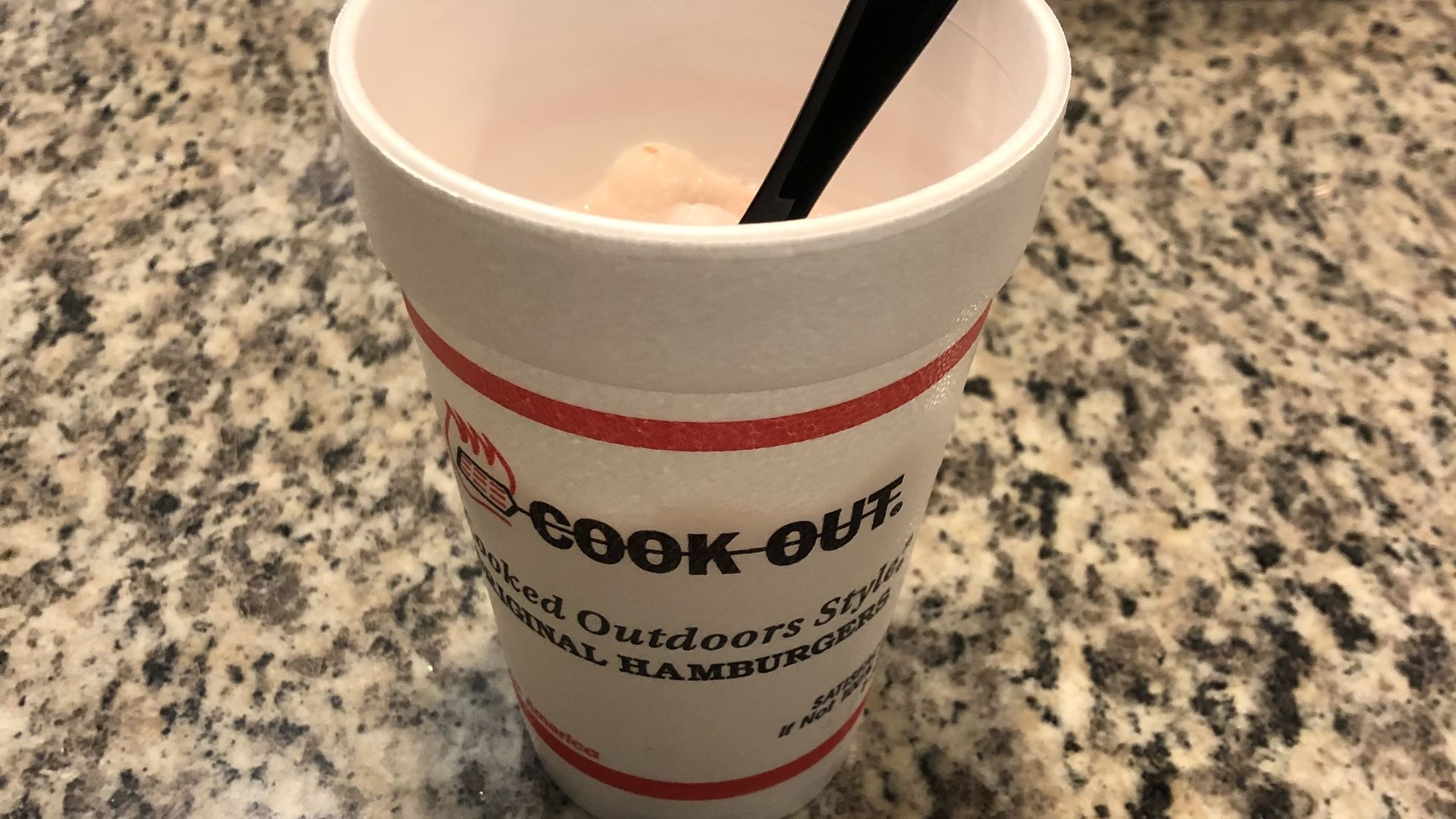 A Cook Out Milkshake on a granite countertop