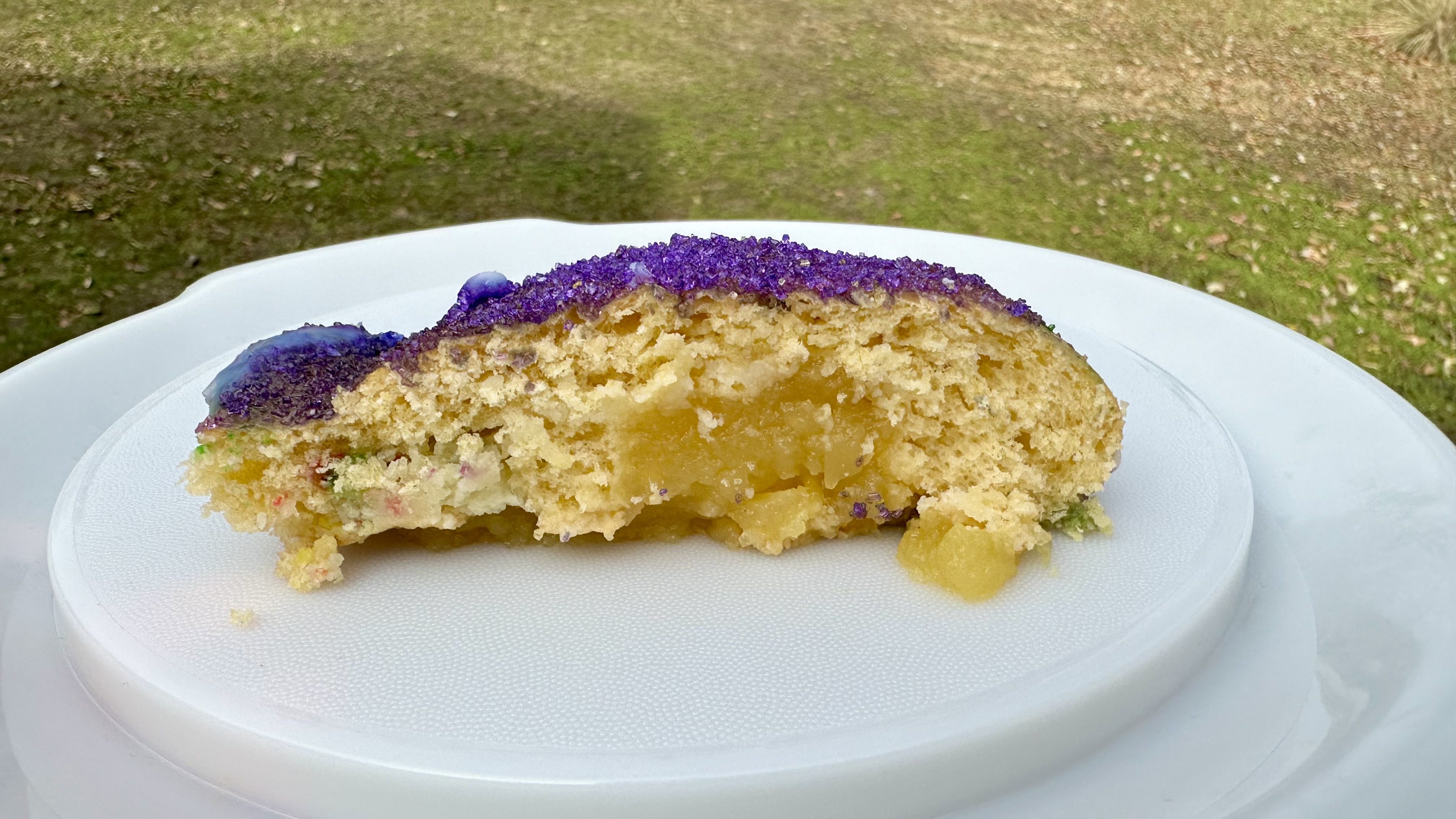 Photo shows a slice of king cake