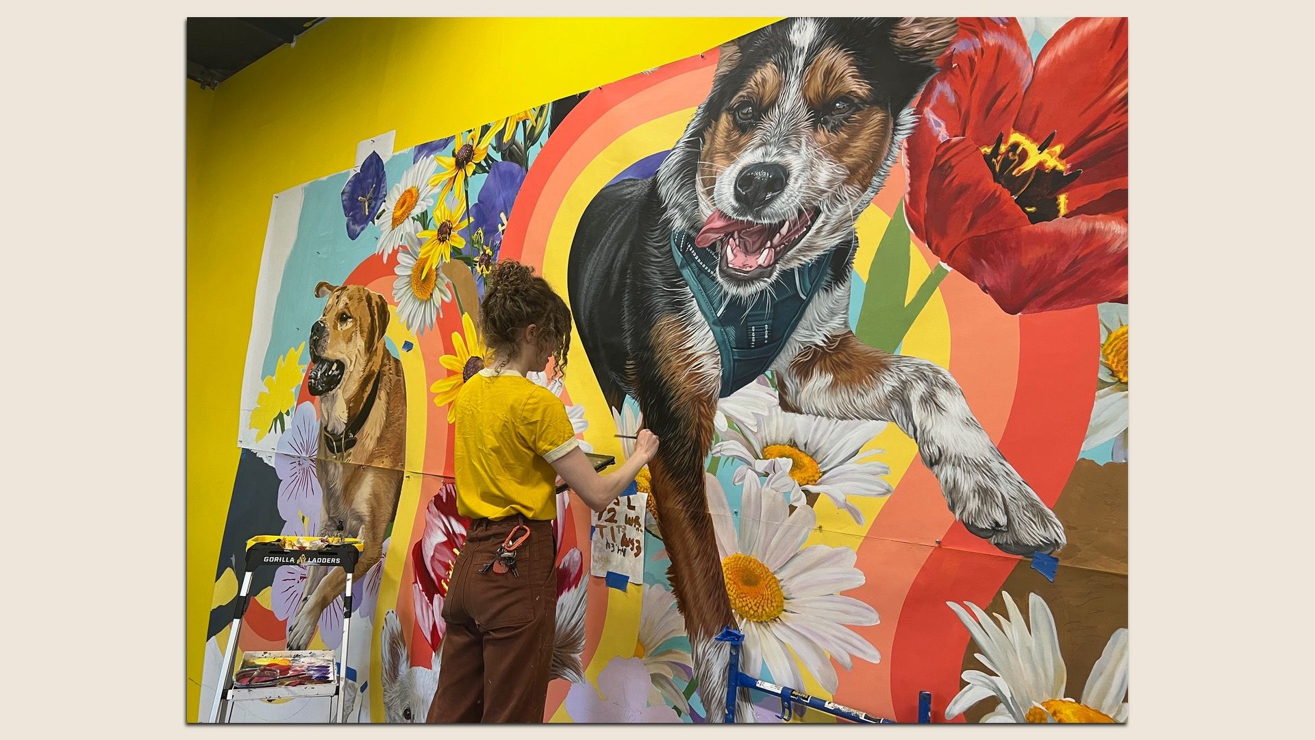 Philly artist Emily White working on her new mural, "Can I Paint That Dog?" in Northern Liberties.