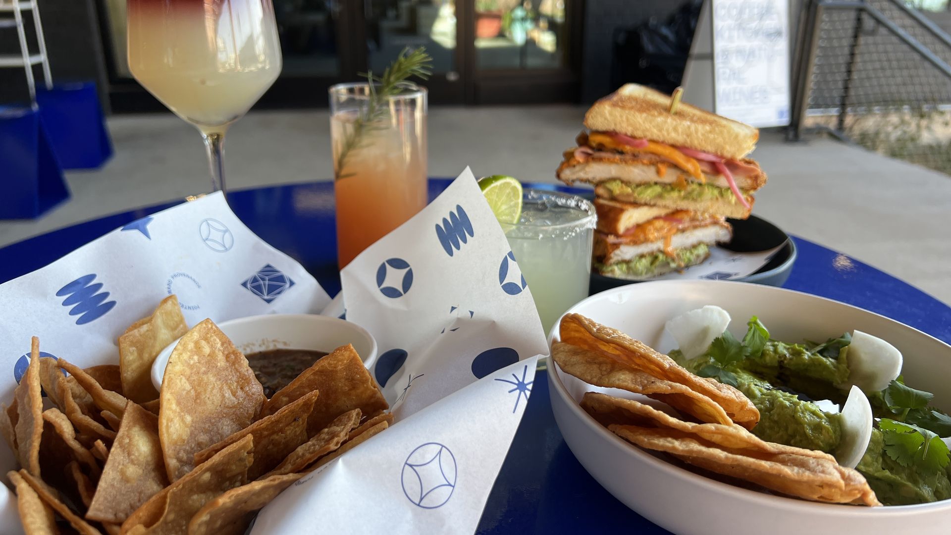 assortment of drinks and food dishes 