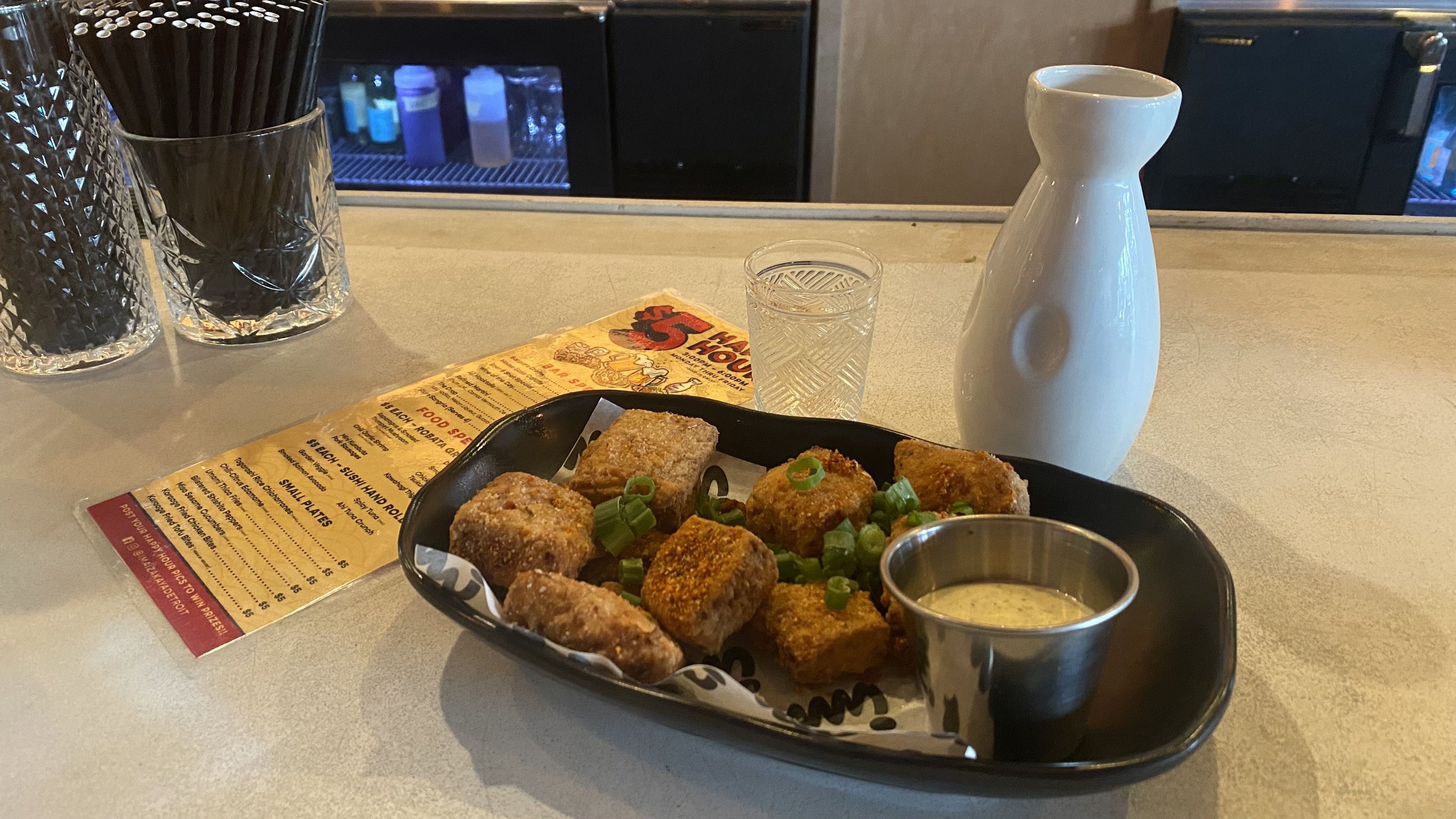 Ima Izakaya's happy hour sake and karaage fried tofu bites. 2100 Michigan Ave. 