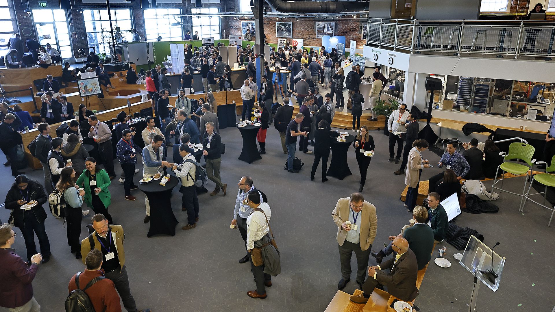 A photo of people milling about the floor of Greentown Labs in Somerville, Mass.