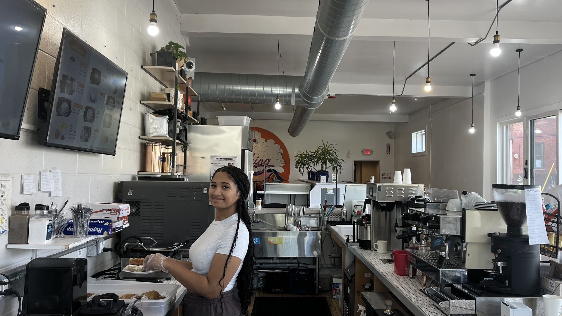 Grace Johns, a barista at The Commons, on the job on April 25, 2025.