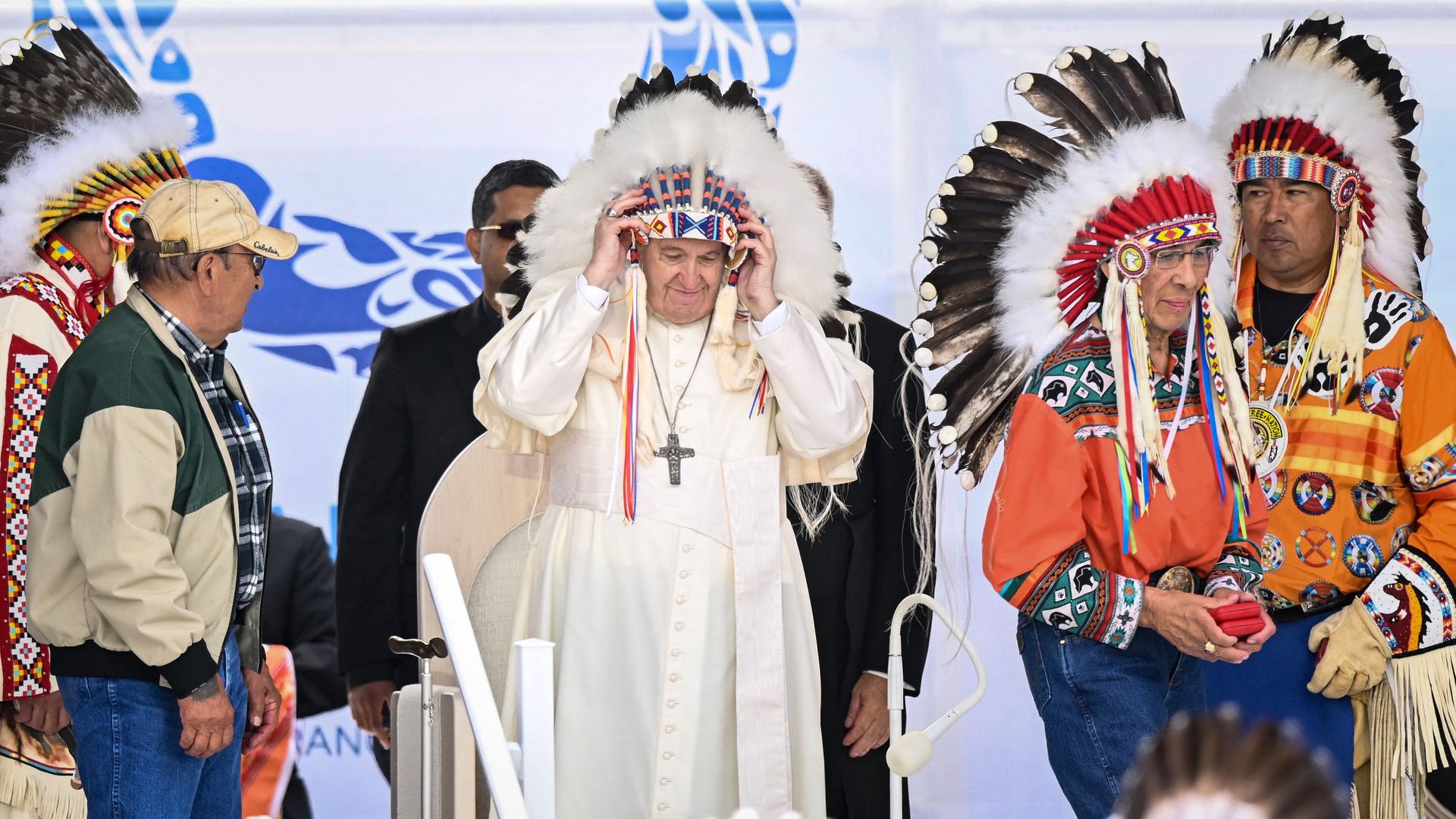 Pope Francis wears a headdress presented to him by Indigenous leaders during a meeting at Muskwa Park in Maskwacis, Alberta, Canada, on July 25.
