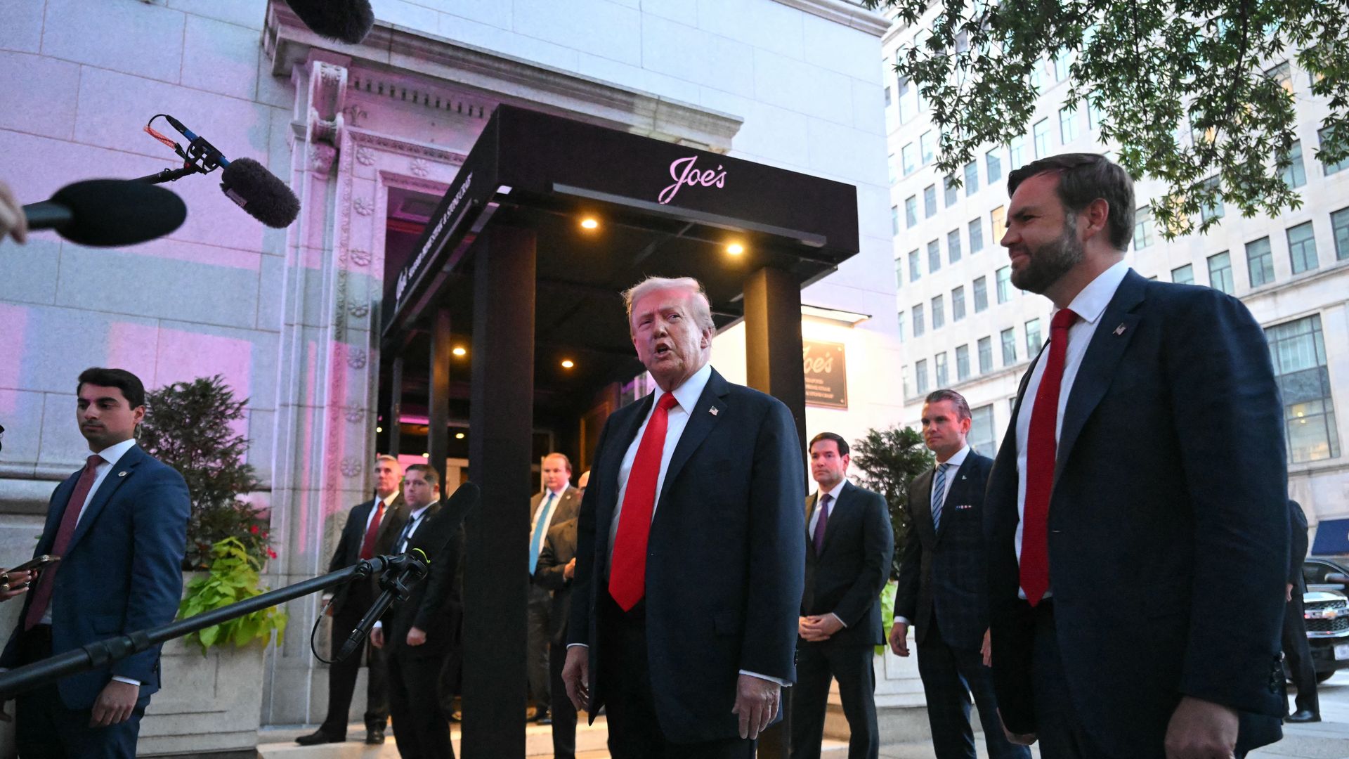 President Trump speaks in front of Joe's restaurant in DC, with Vice President Vance to his left.