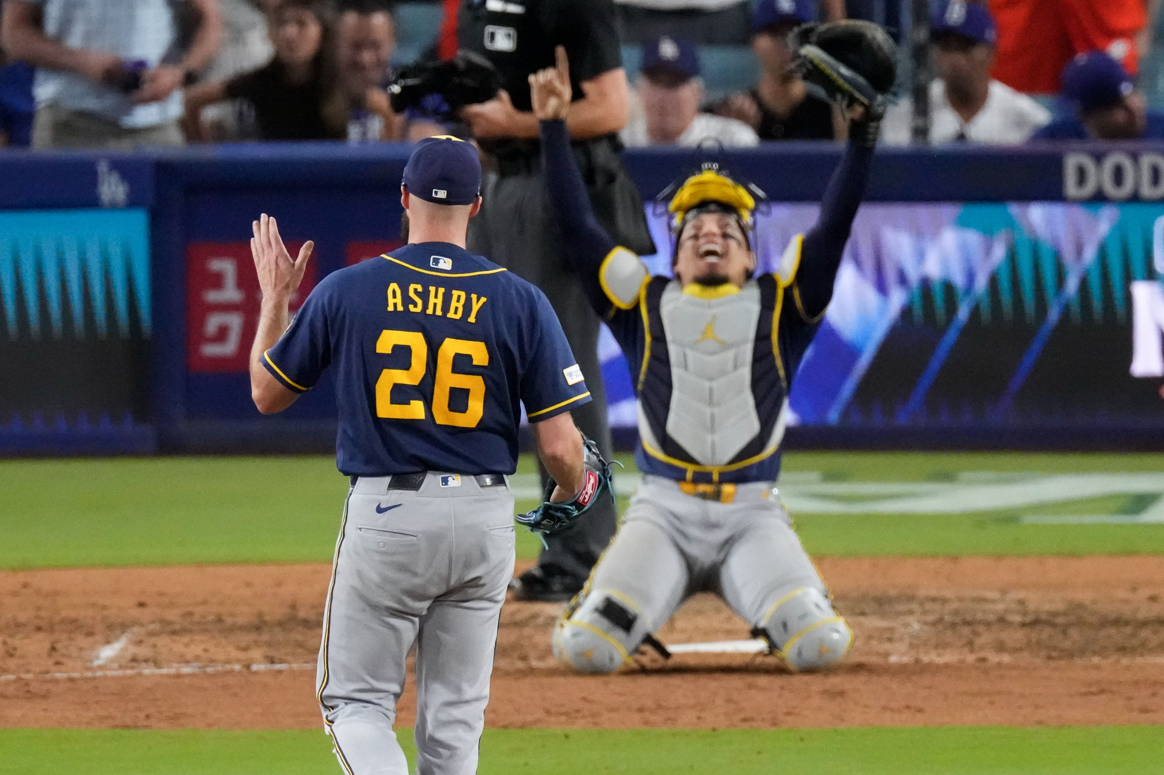 Milwaukee Brewers pitcher Aaron Ashby and catcher William Contreras celebrate after advancing to the World Series on Thursday.