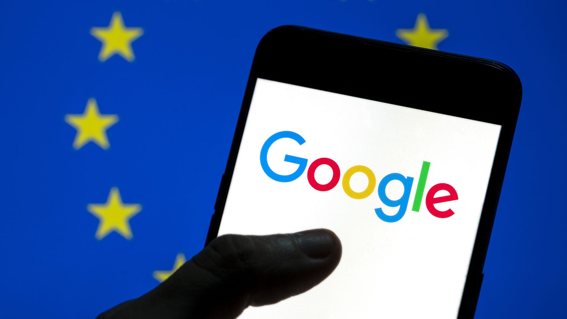 In this photo illustration the American multinational technology company and search engine Google logo is seen on an Android mobile device screen with the EU flag in the background.