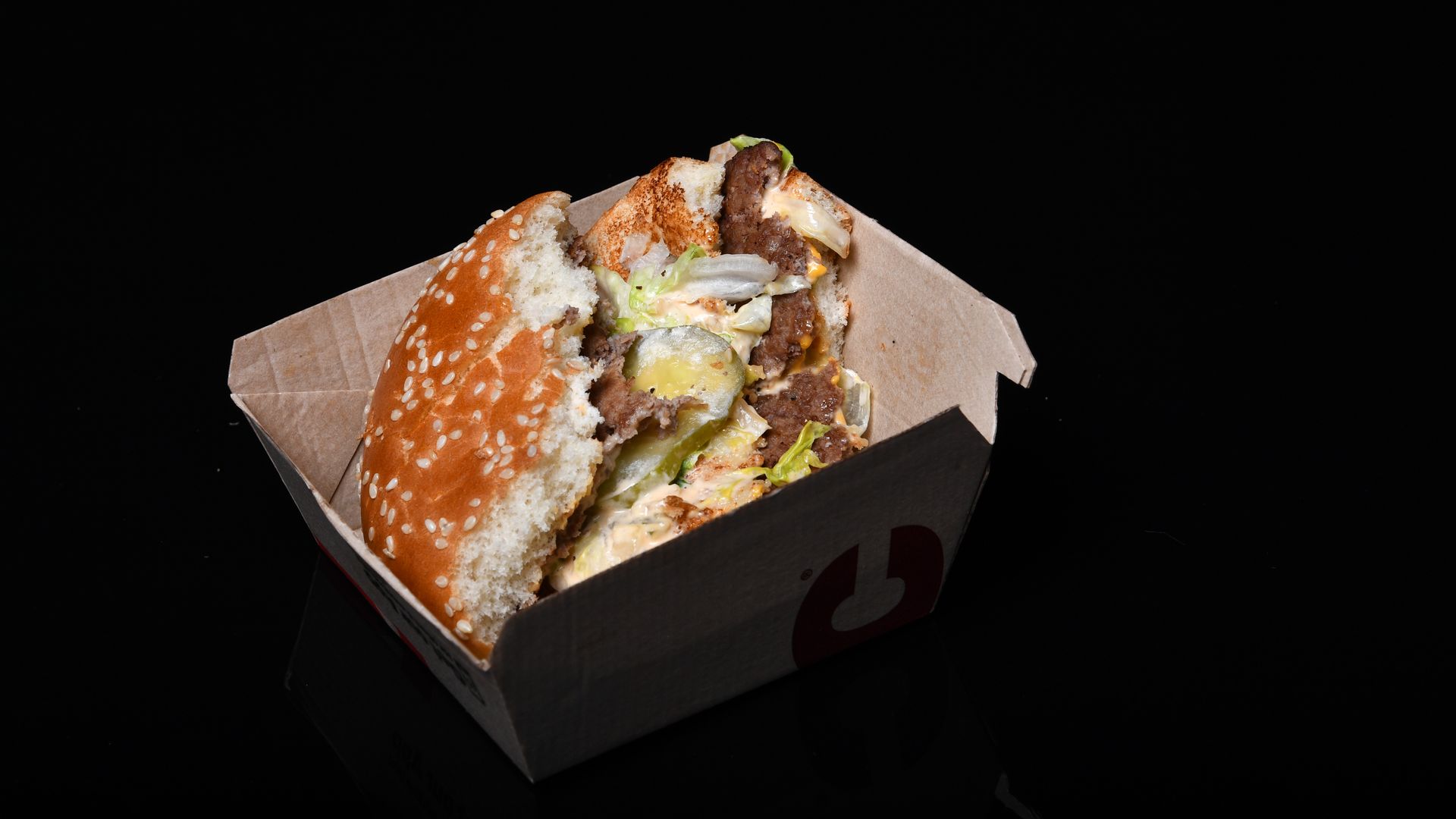 A photo of a half-eaten hamburger