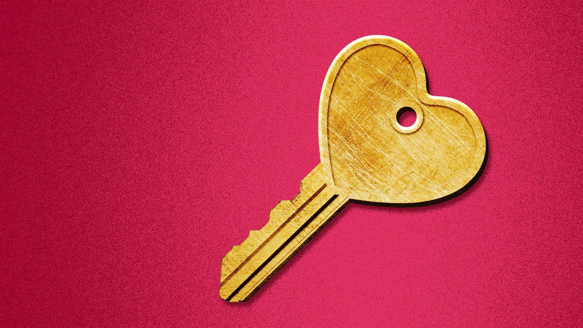 a key with a heart on a red backygound