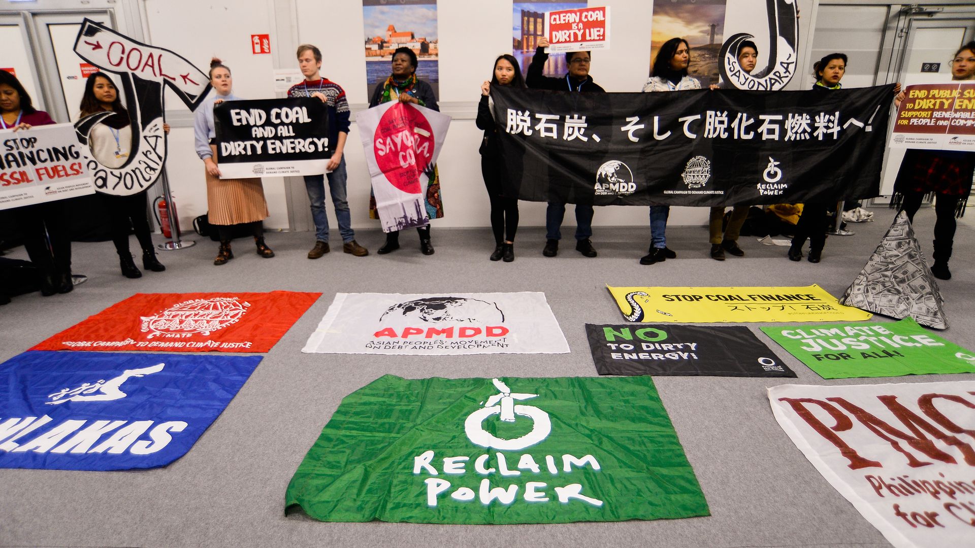 Protestors highlight the divide at a global climate conference around fossil fuels.