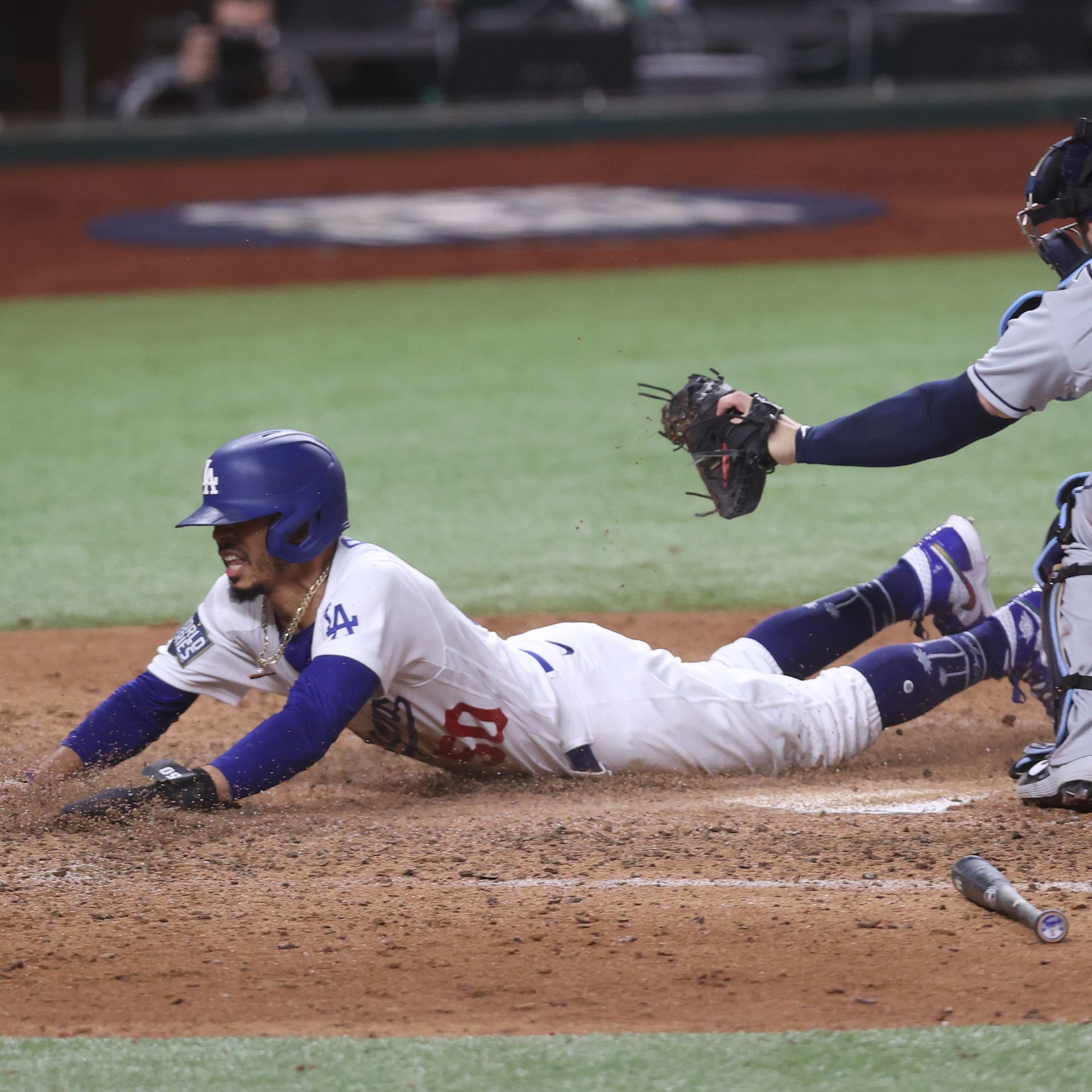 Mookie Betts slides in safe at home plate to give the Dodgers a 2-1 lead in Game 6