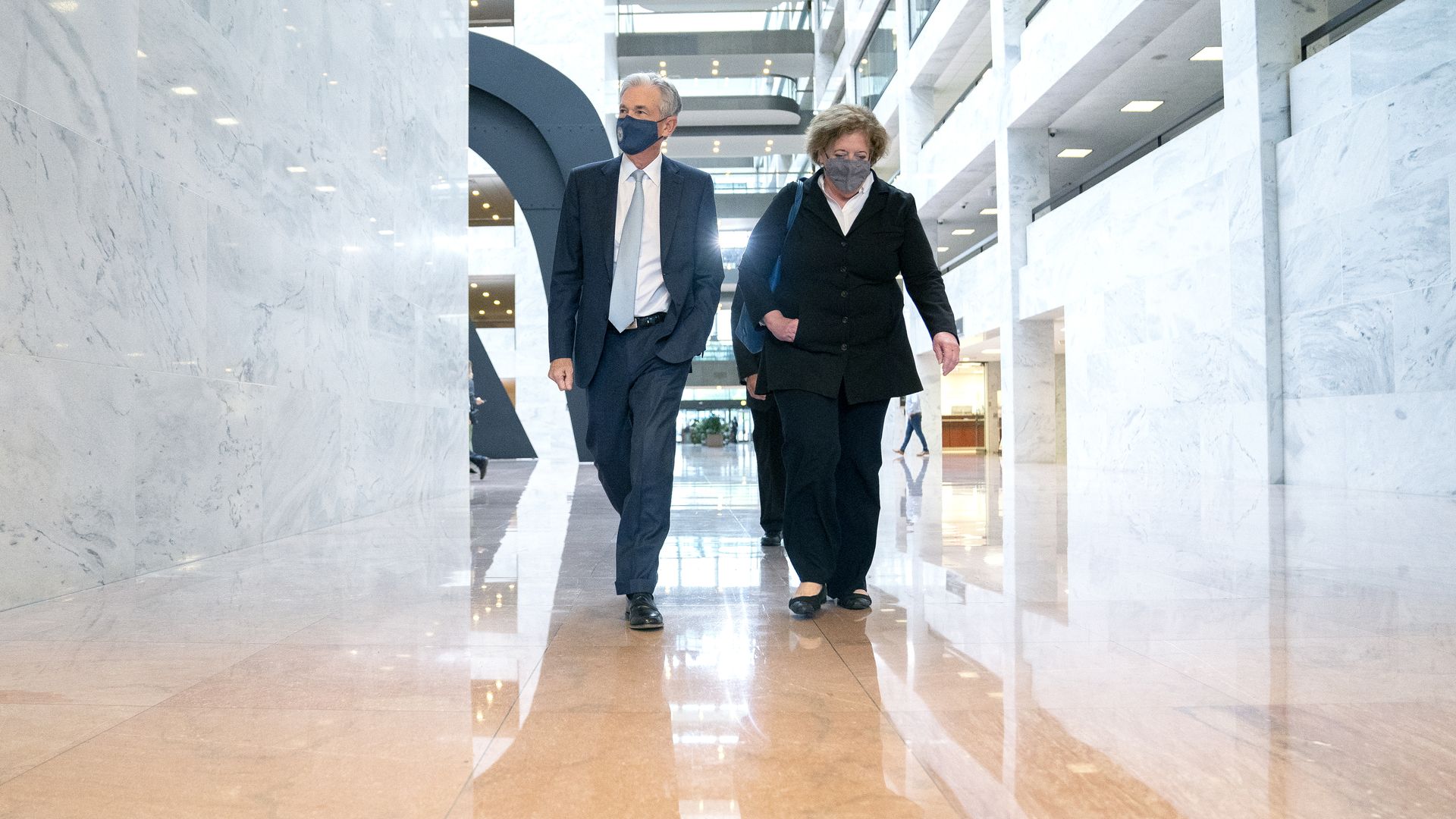 Federal Reserve Chairman Jerome Powell is seen walking through the Hart Senate Office Building.